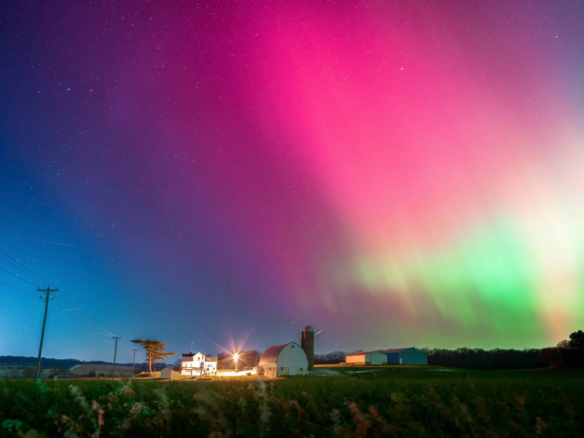 The Aurora Borealis lights up the night sky over Monroe, Wisconsin, on November 11, 2025, during one of the strongest solar storms in decades (Image via Getty)