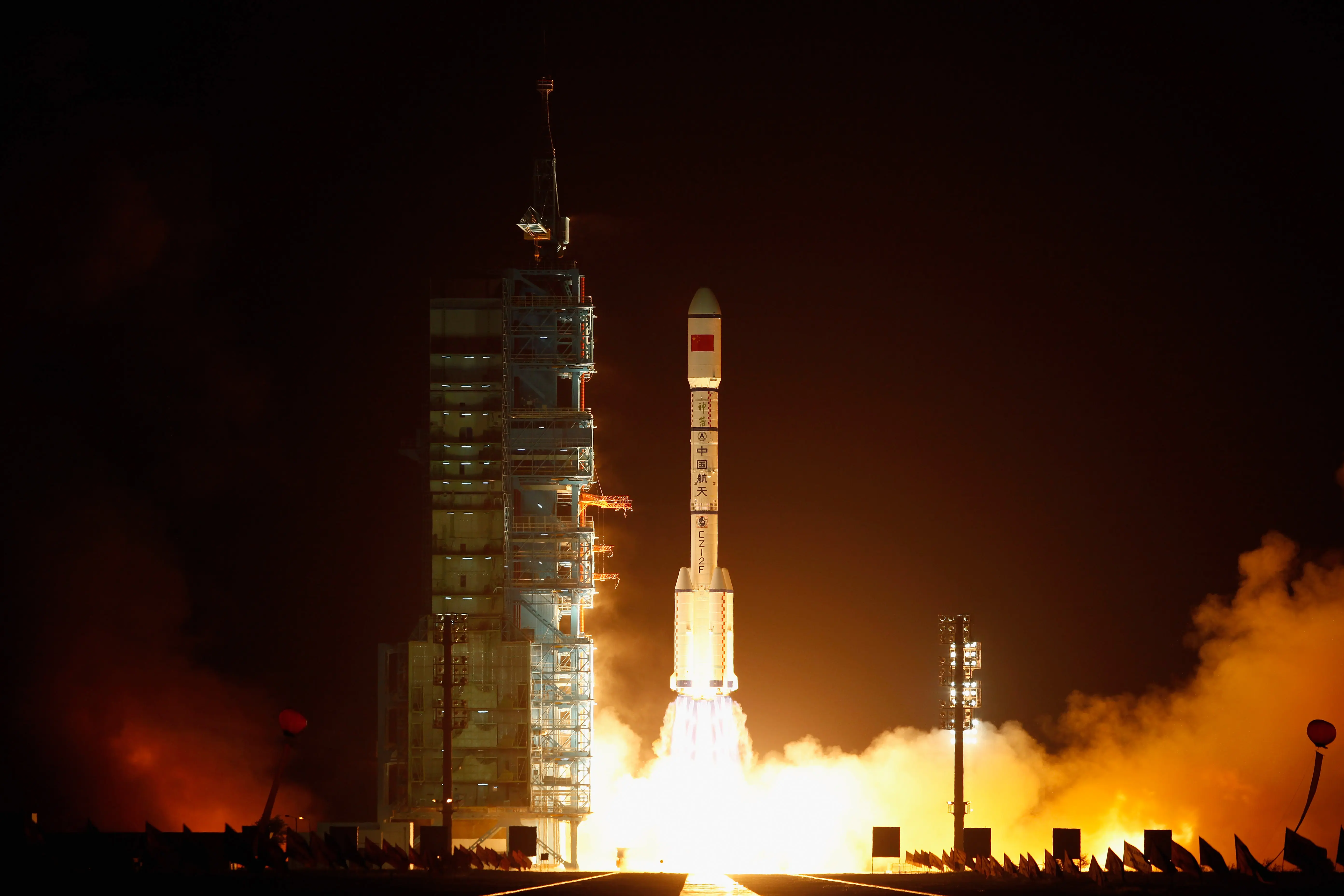 A Long March 2F rocket carrying the country's first space laboratory module Tiangong-1 lifts off from the Jiuquan Satellite Launch Center on September 29, 2011 in Jiuquan, Gansu province of China. The unmanned Tiangong-1 will stay in orbit for two years and dock with China's Shenzhou-8, -9 and -10 spacecraft with the eventual goal of establishing a manned Chinese space station around 2020 (Image via Getty)
