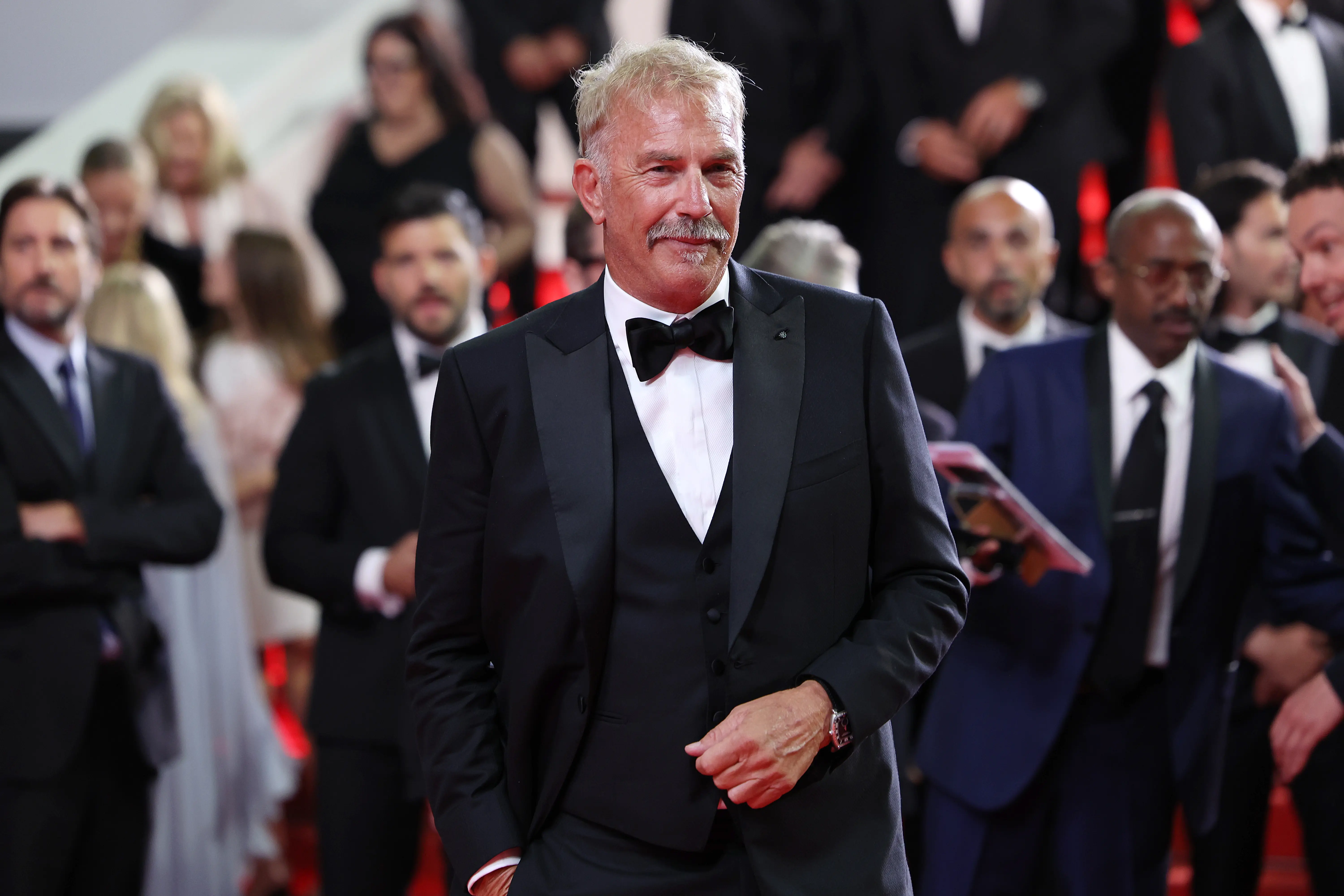 Kevin Costner departs the "Horizon: An American Saga" Red Carpet at the 77th annual Cannes Film Festival at Palais des Festivals(Image via Getty)