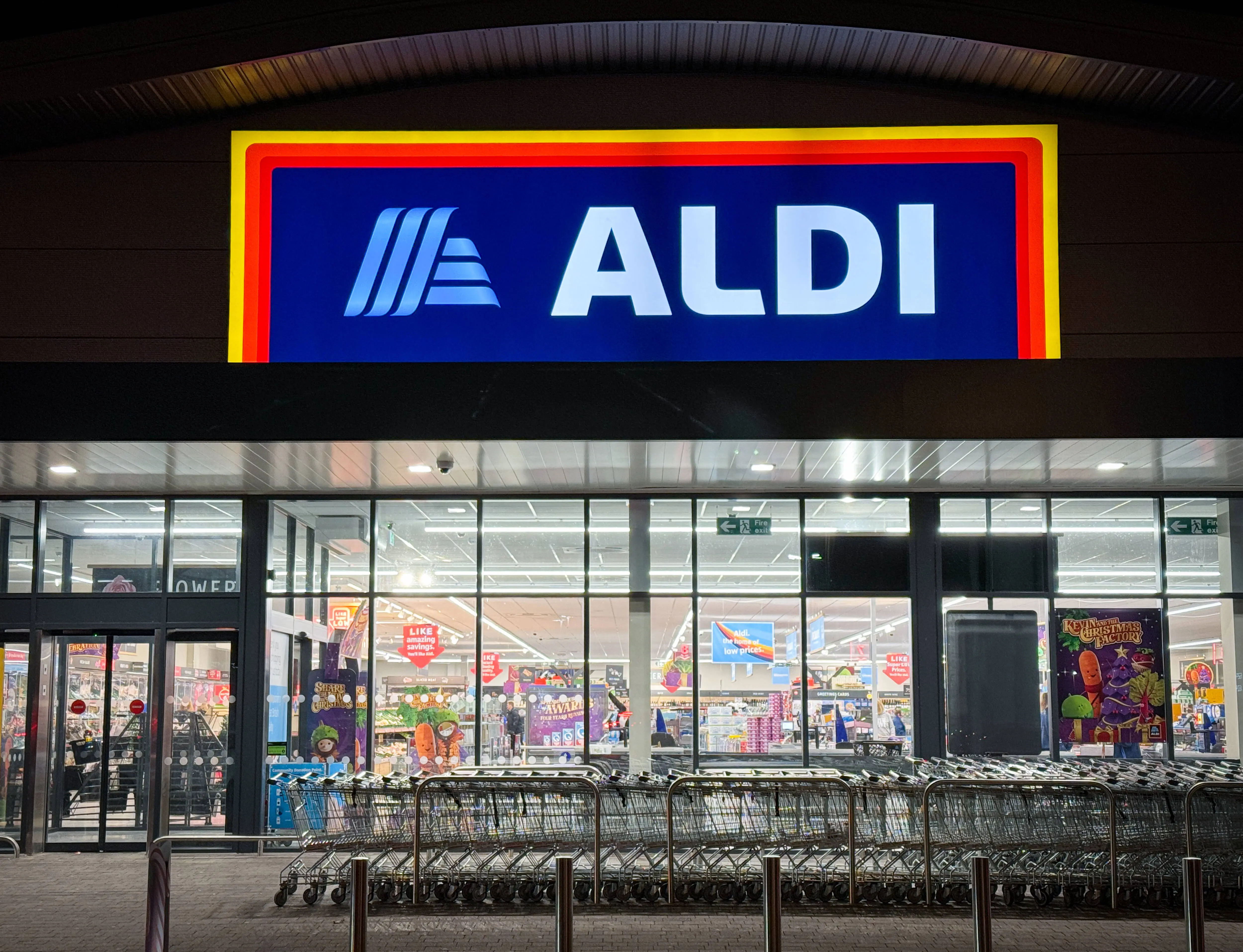 PORTISHEAD, UNITED KINGDOM - NOVEMBER 11: Shoppers enter a branch of the budget supermarket retailer Aldi on November 11, 2023 in Portishead, England. The German retailer founded in 1946, has been gaining popularity with shoppers of groceries in the UK. (Photo by Matt Cardy/Getty Images)