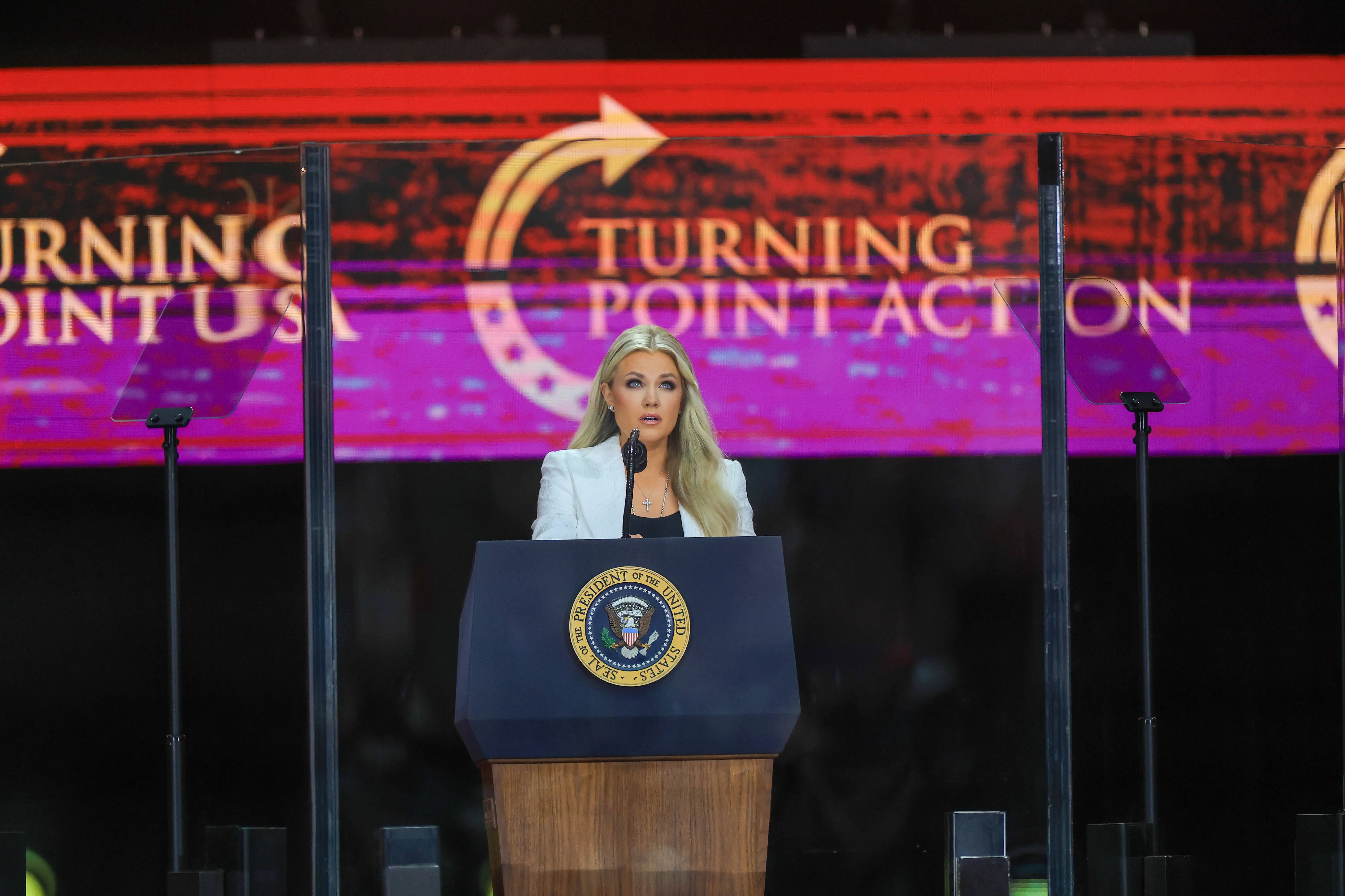 GLENDALE, ARIZONA - SEPTEMBER 21: Mrs. Erika Kirk speaks during the memorial service for her husband, political activist Charlie Kirk at State Farm Stadium on September 21, 2025 in Glendale, Arizona. Kirk, the CEO and co-founder of Turning Point USA, was shot and killed on September 10th while speaking at an event during his "American Comeback Tour" at Utah Valley University. (Photo by Joe Raedle/Getty Images)