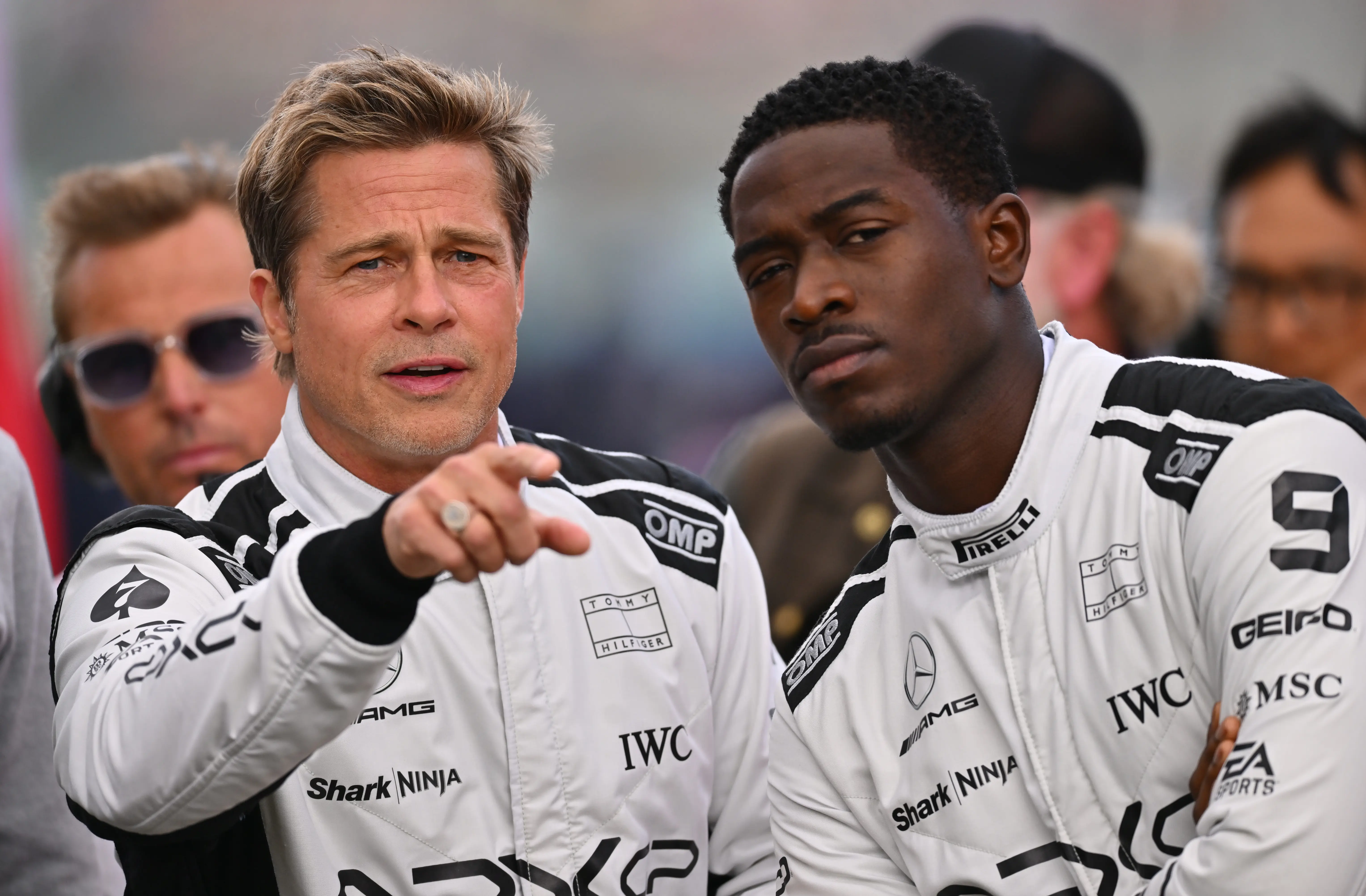 NORTHAMPTON, ENGLAND - JULY 09: Brad Pitt, star of the upcoming Formula One based movie, Apex, and Damson Idris, co-star of the upcoming Formula One based movie, Apex, look on from the grid during the F1 Grand Prix of Great Britain at Silverstone Circuit on July 09, 2023 in Northampton, England. (Photo by Dan Mullan/Getty Images)