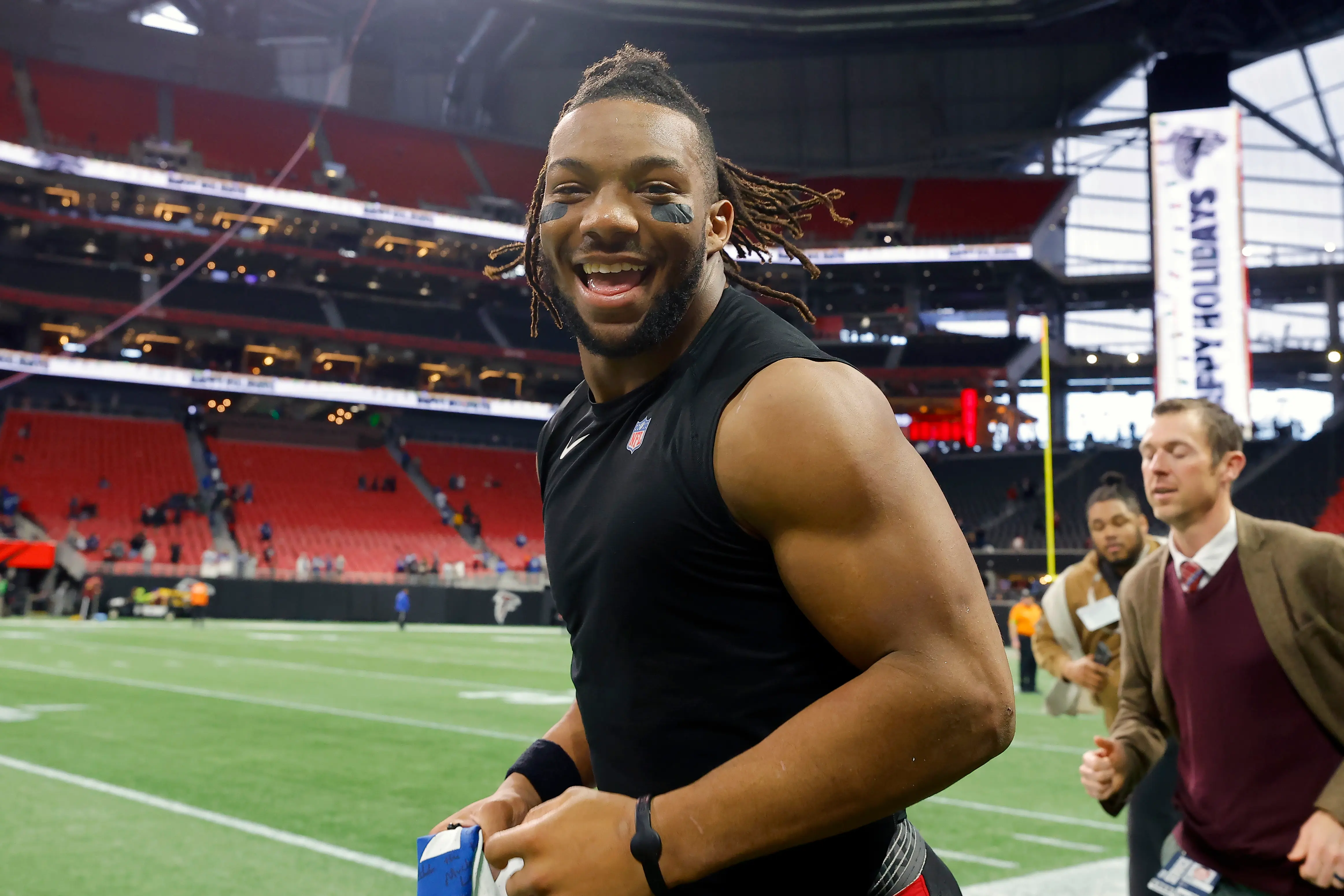 ATLANTA, GEORGIA - DECEMBER 24: Bijan Robinson #7 of the Atlanta Falcons runs on the field after a win over the Indianapolis Colts at Mercedes-Benz Stadium on December 24, 2023 in Atlanta, Georgia. (Photo by Todd Kirkland/Getty Images)