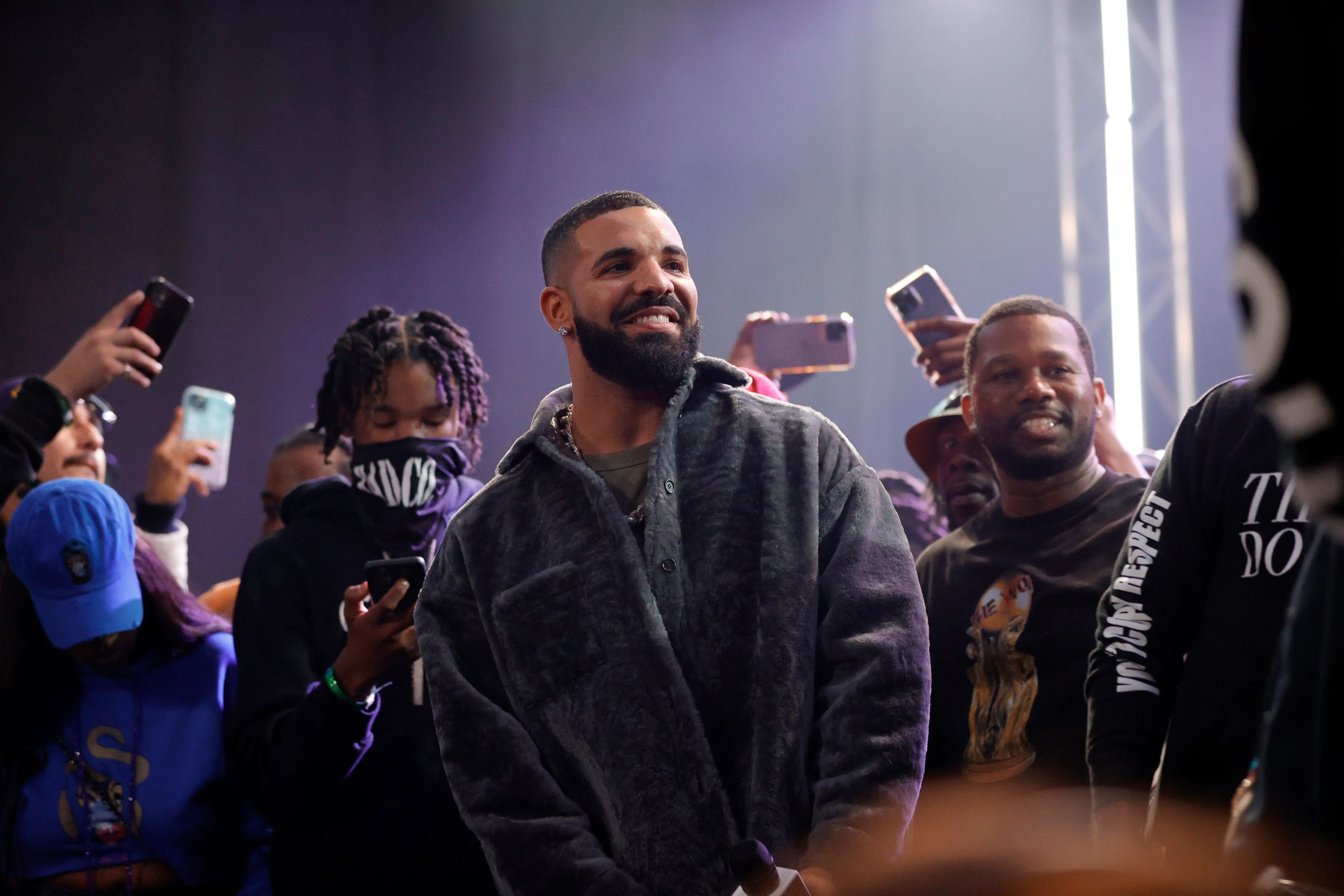 LONG BEACH, CALIFORNIA - OCTOBER 30: Drake speaks  onstage during Drake's Till Death Do Us Part rap battle on October 30, 2021 in Long Beach, California. (Photo by Amy Sussman/Getty Images)