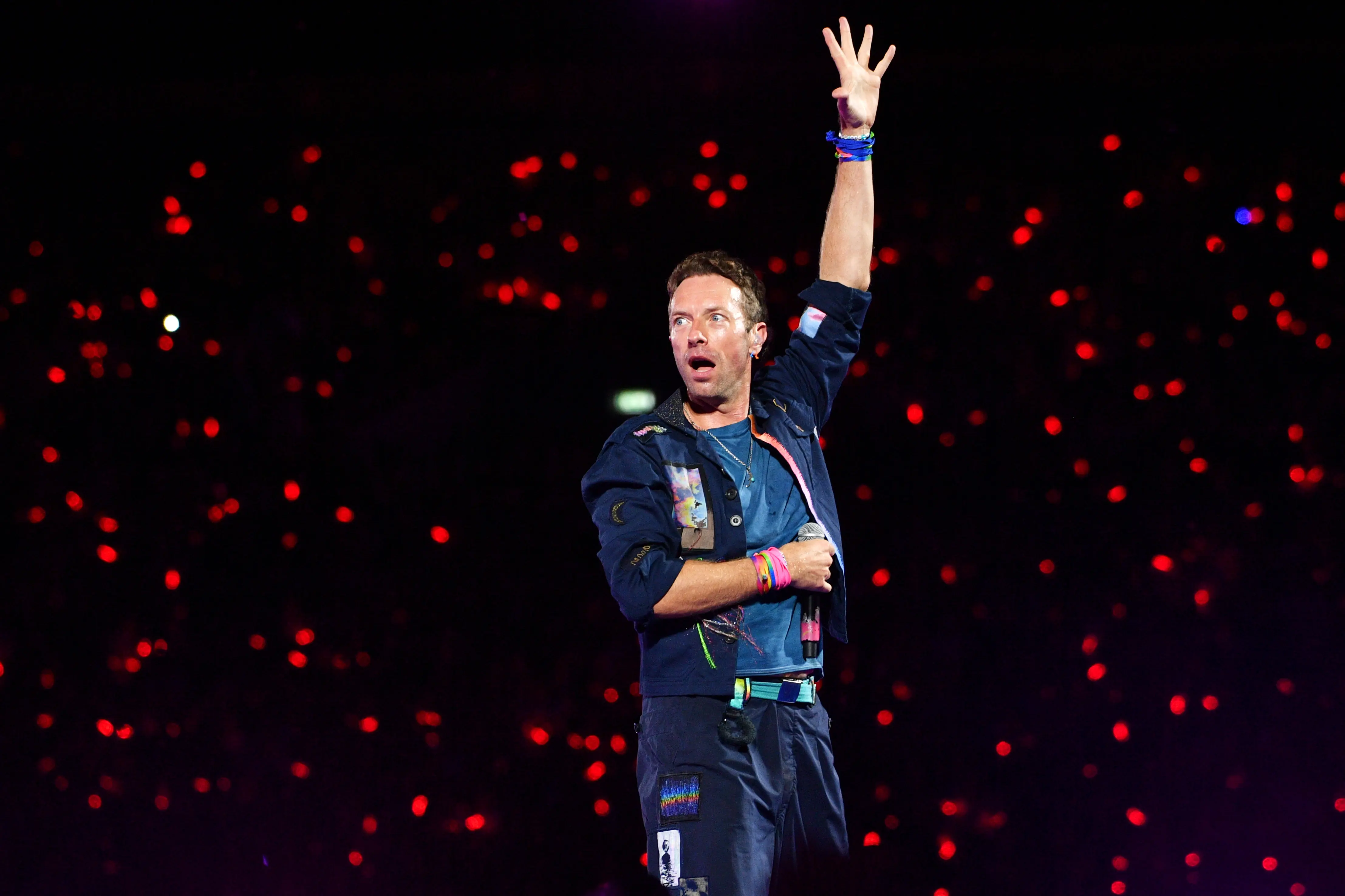 LONDON, ENGLAND - AUGUST 22: (EDITORIAL USE ONLY) Chris Martin of Coldplay performs during the 'Music Of The Spheres World Tour' at Wembley Stadium on August 22, 2025 in London, England. Coldplay will perform ten shows at Wembley Stadium during August &amp; September, bringing to a close the most-attended concert tour in history, watched by over 12 million fans across 43 countries. (Photo by Jim Dyson/Getty Images)