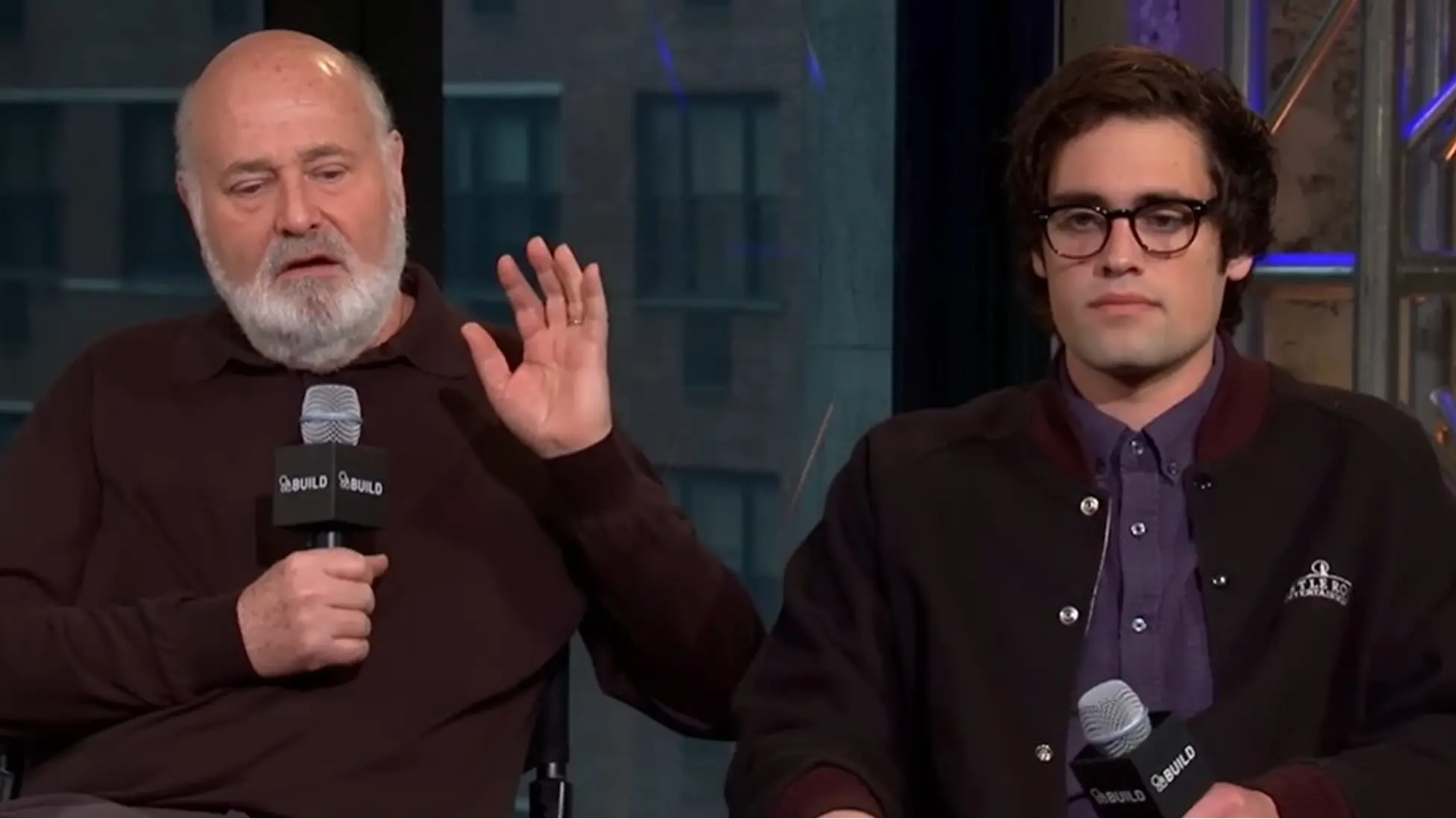 Rob Reiner speaks alongside son Nick Reiner during a BUILD Series conversation for Being Charlie. Image via YouTube/@Rob Reiner And Nick Reiner On "Being Charlie" (BUILD Series).