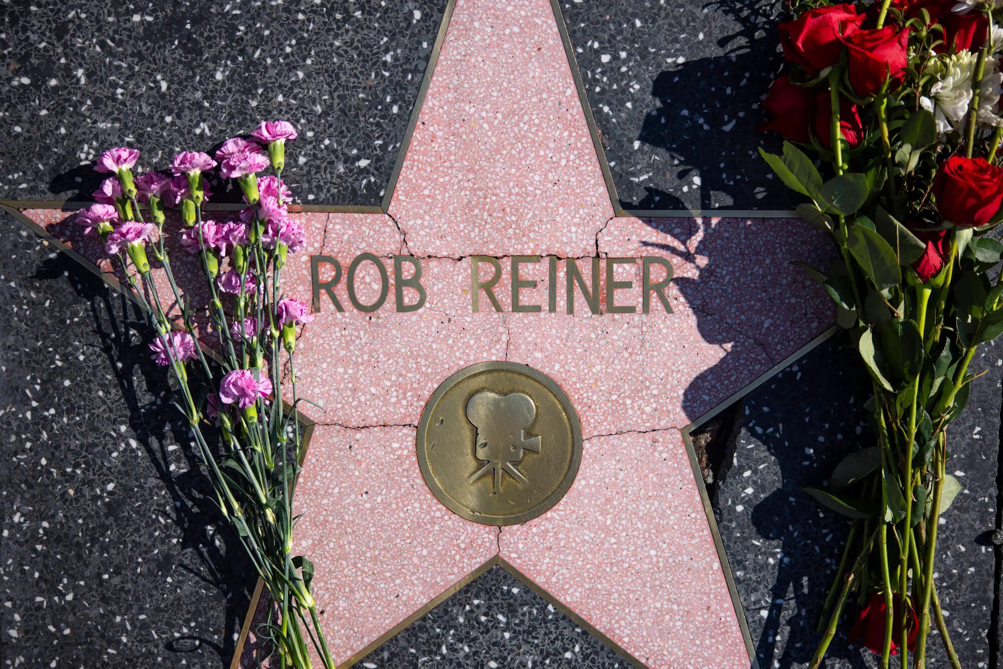 Los Angeles, CA - December 15, 2025: Flowers are seen placed ontop of Rob Reiner's Hollywood Walk of Fame Star on Monday, Dec. 15, 2025 in Los Angeles, CA. Nick Reiner was arrested on suspicion of homicide of his parents Rob and Michele Singer Reiner after they were found dead at their Brentwood home on Sunday. (Kayla Bartkowski / Los Angeles Times via Getty Images)