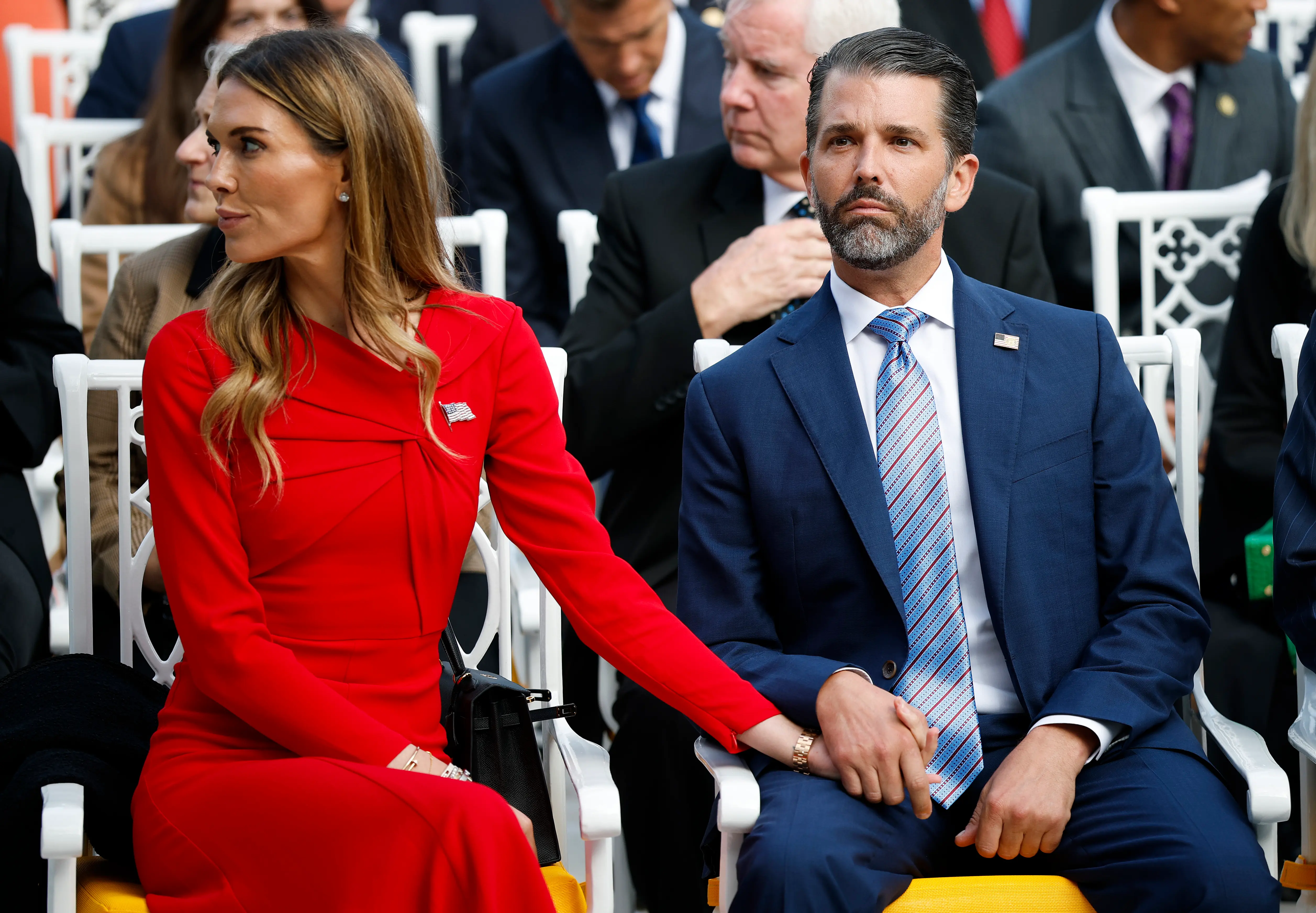 Donald Trump Jr. (R) sits with Bettina Anderson prior to a Presidential Medal of Freedom ceremony (Image via Getty)