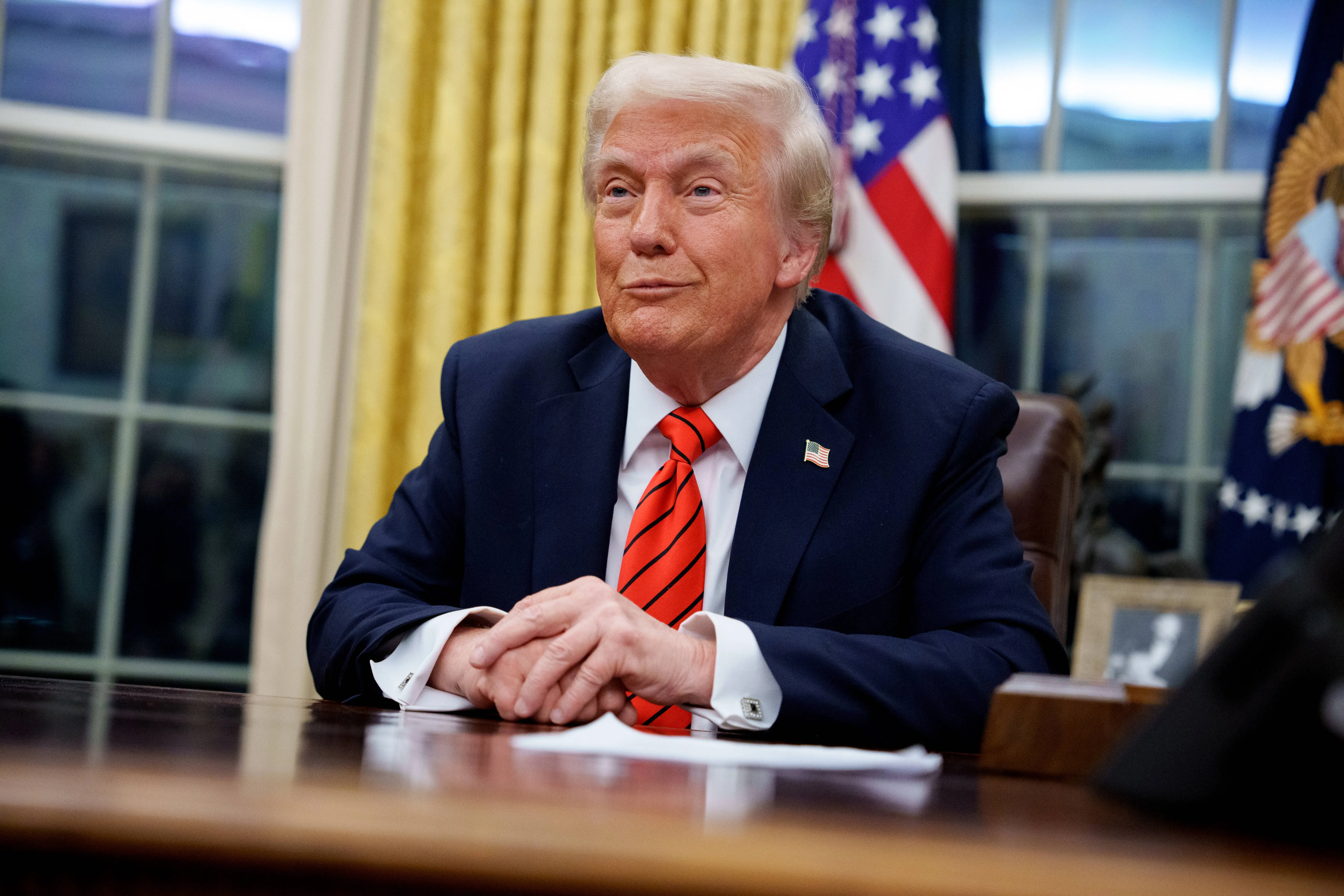 WASHINGTON, DC - FEBRUARY 10: U.S. President Donald Trump reacts to a question from a reporter after signing a series of executive orders including 25% tariffs on steel and aluminum, a pardon for former Illinois Gov. Rod Blagojevich, an order relating to the Foreign Corrupt Practices Act, and an order for the federal government to stop using paper straws and begin using plastic straws in the Oval Office at the White House on February 10, 2025 in Washington, DC. Trump has signed more than 50 executive orders as of Friday, the most in a president's first 100 days in more than 40 years. (Photo by Andrew Harnik/Getty Images)