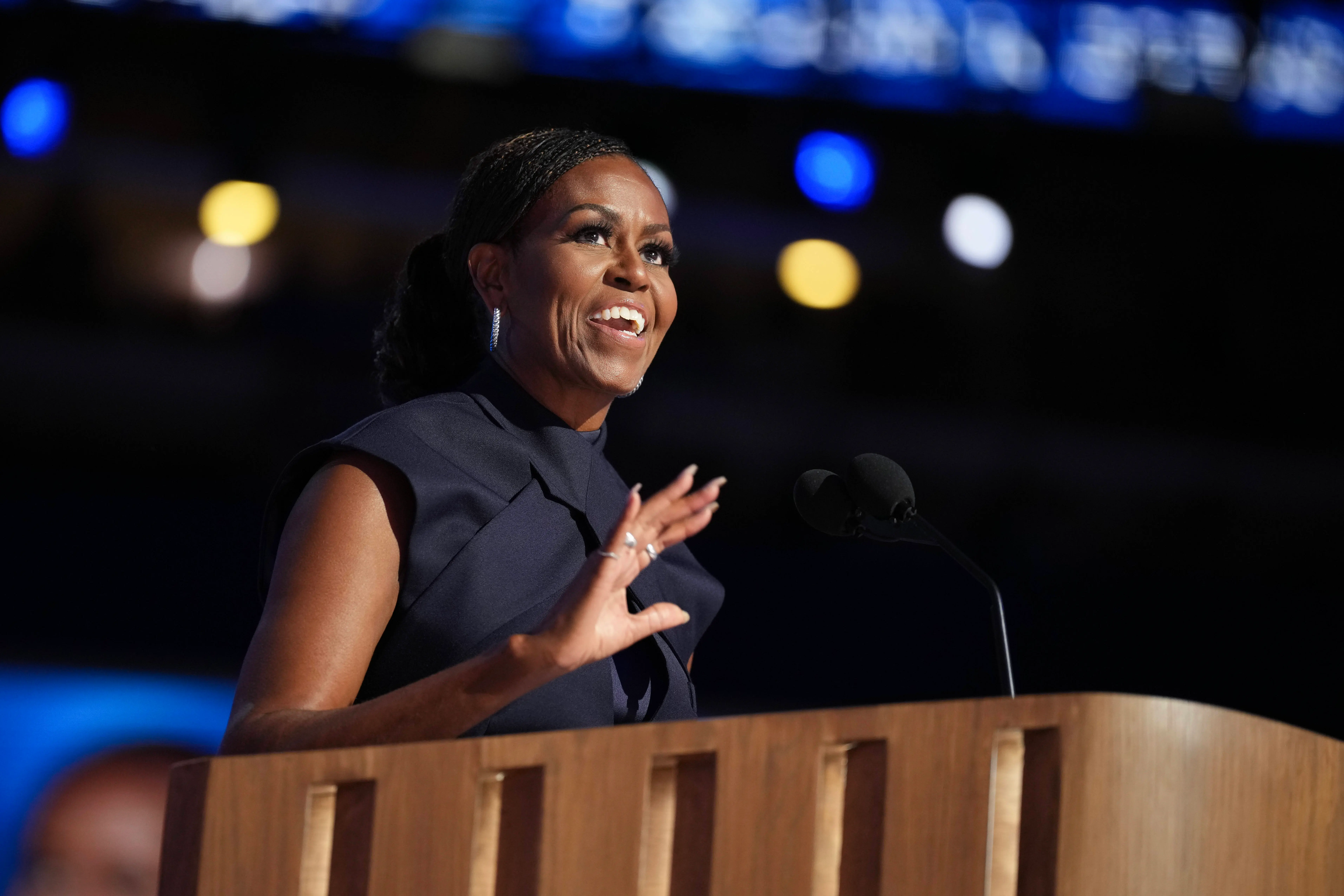 CHICAGO, ILLINOIS - AUGUST 20: Former first lady Michelle Obama speaks on stage during the second day of the Democratic National Convention at the United Center on August 20, 2024 in Chicago, Illinois. Delegates, politicians, and Democratic Party supporters are gathering in Chicago, as current Vice President Kamala Harris is named her party's presidential nominee. The DNC takes place from August 19-22. (Photo by Andrew Harnik/Getty Images)