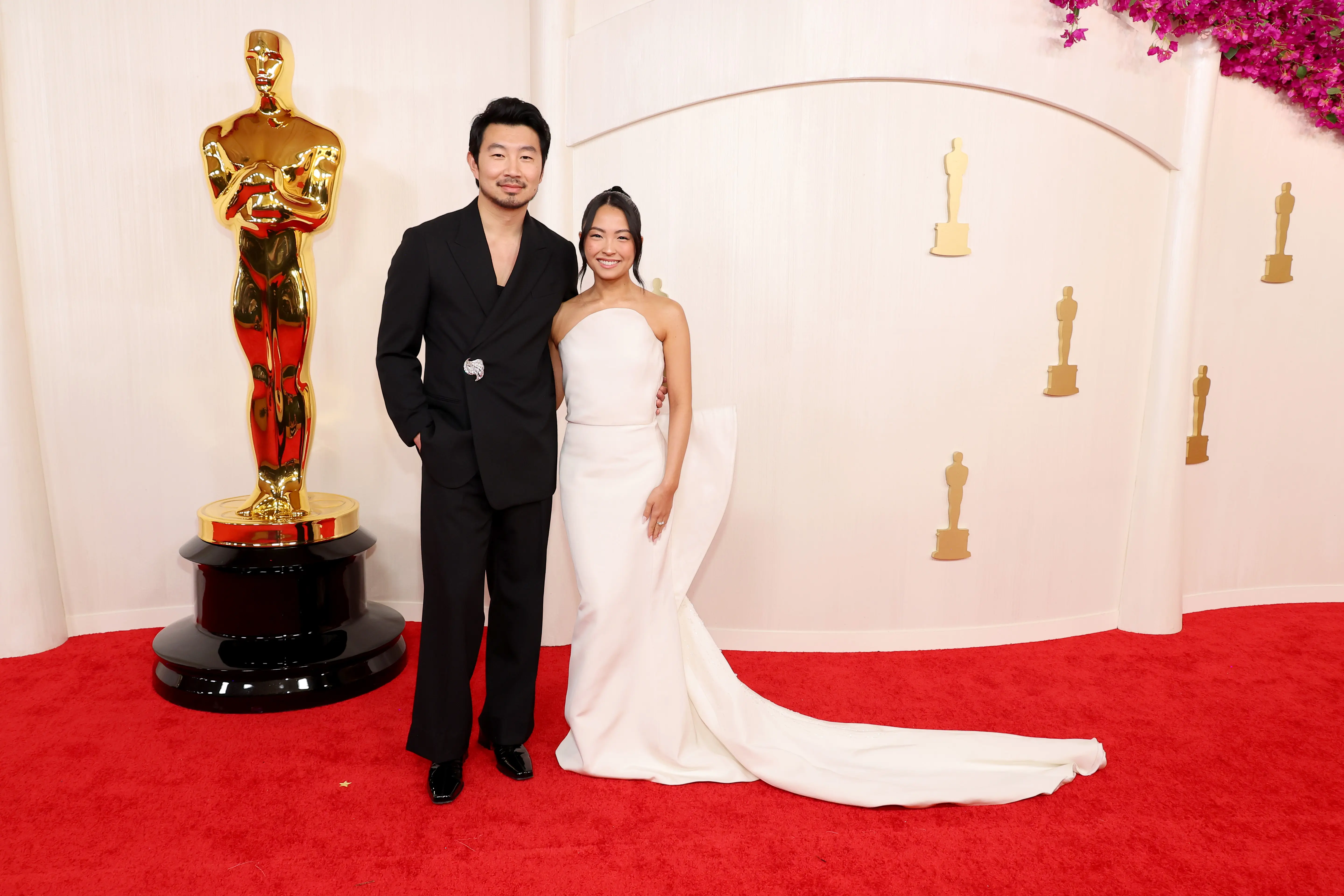 HOLLYWOOD, CALIFORNIA - MARCH 10: (L-R) Simu Liu and Allison Hsu attend the 96th Annual Academy Awards on March 10, 2024 in Hollywood, California. (Photo by Mike Coppola/Getty Images)