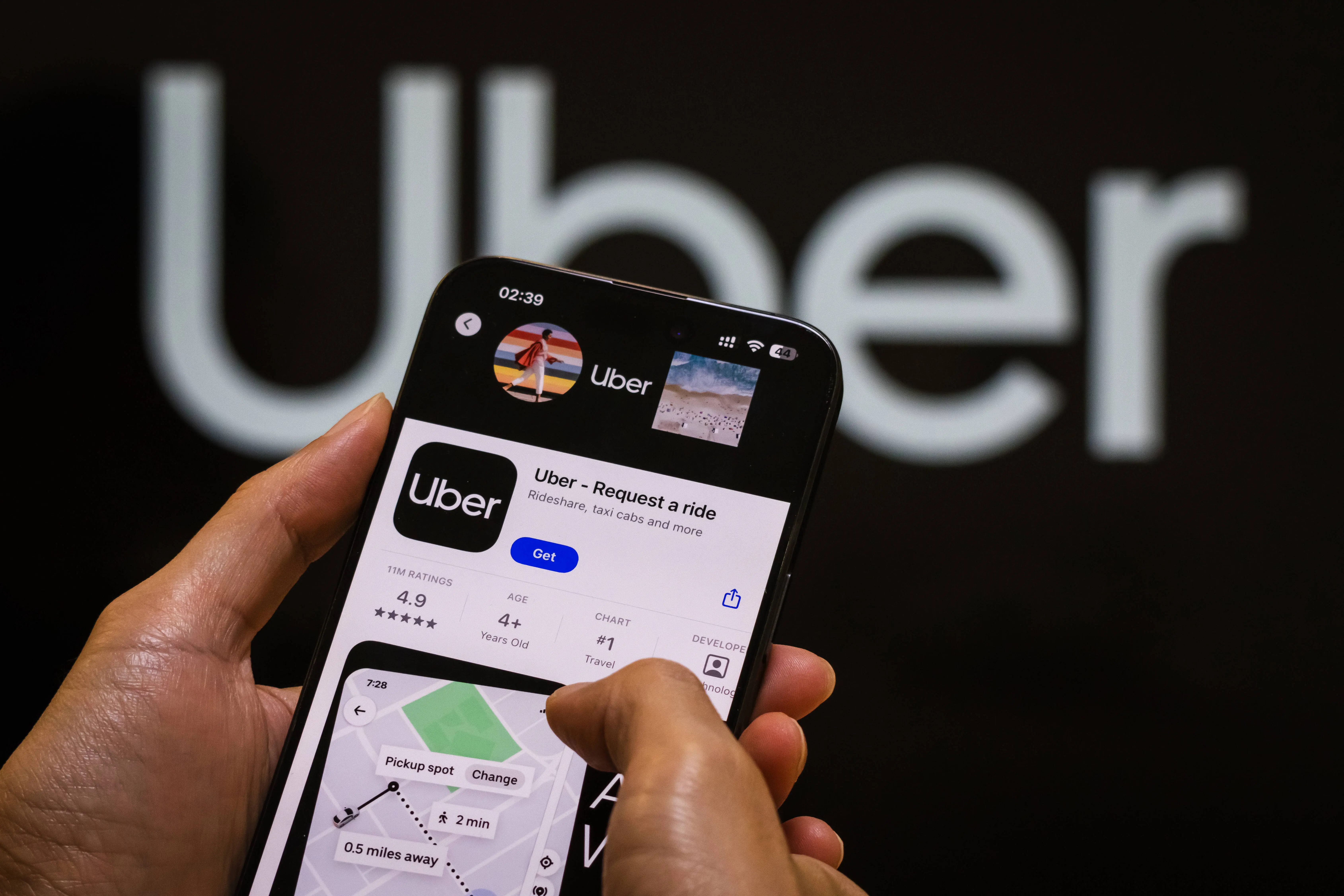 CHONGQING, CHINA - OCTOBER 31: The Uber app page is displayed on a smartphone in the Apple App Store in front of the Uber Technologies, Inc. logo on October 31, 2024 in Chongqing, China. (Photo by Cheng Xin/Getty Images)