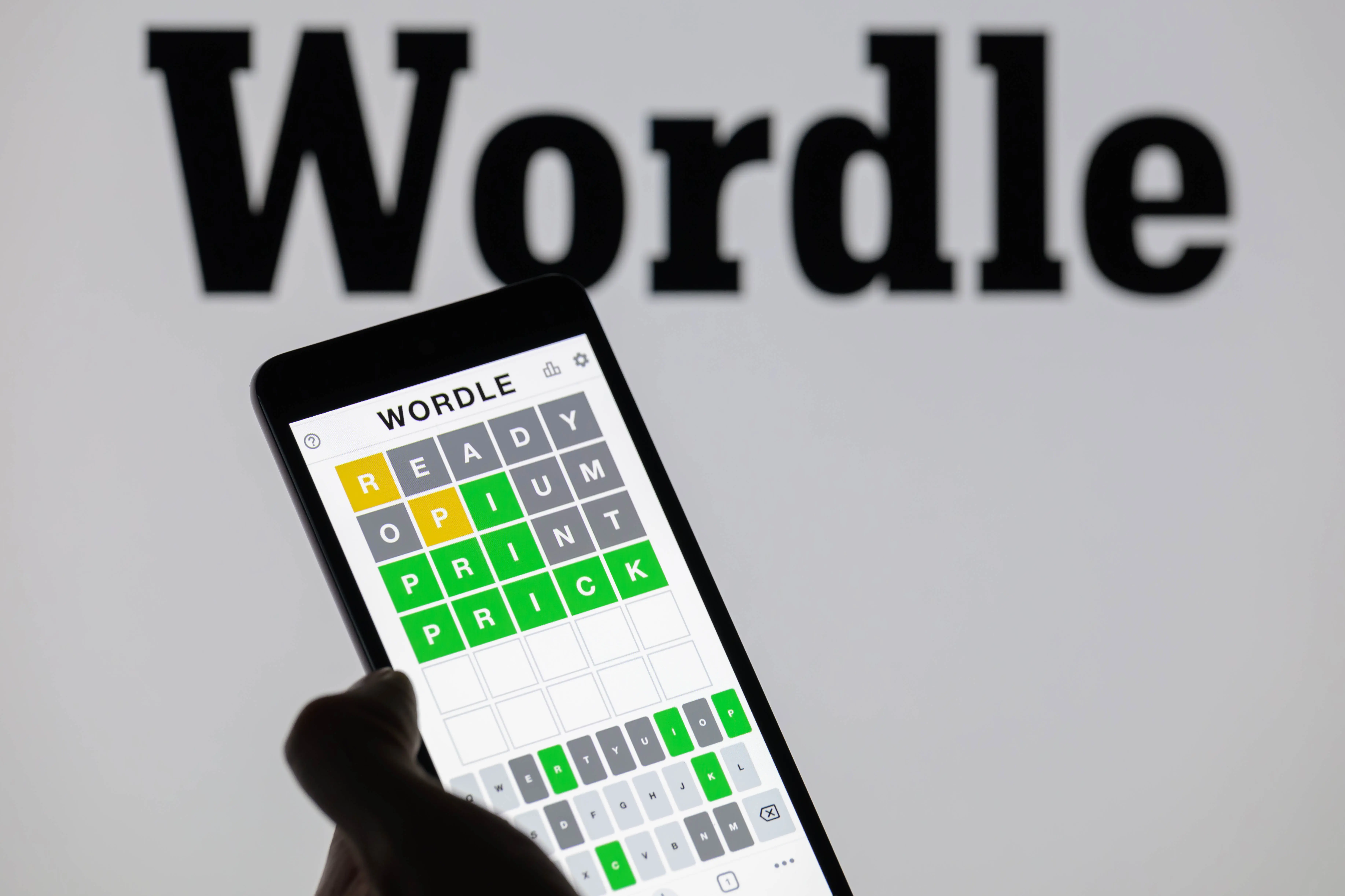The Wordle game app is being displayed on a smartphone with Wordle visible in the background in this photo illustration in Brussels, Belgium, on June 1, 2024. (Photo by Jonathan Raa/NurPhoto via Getty Images)