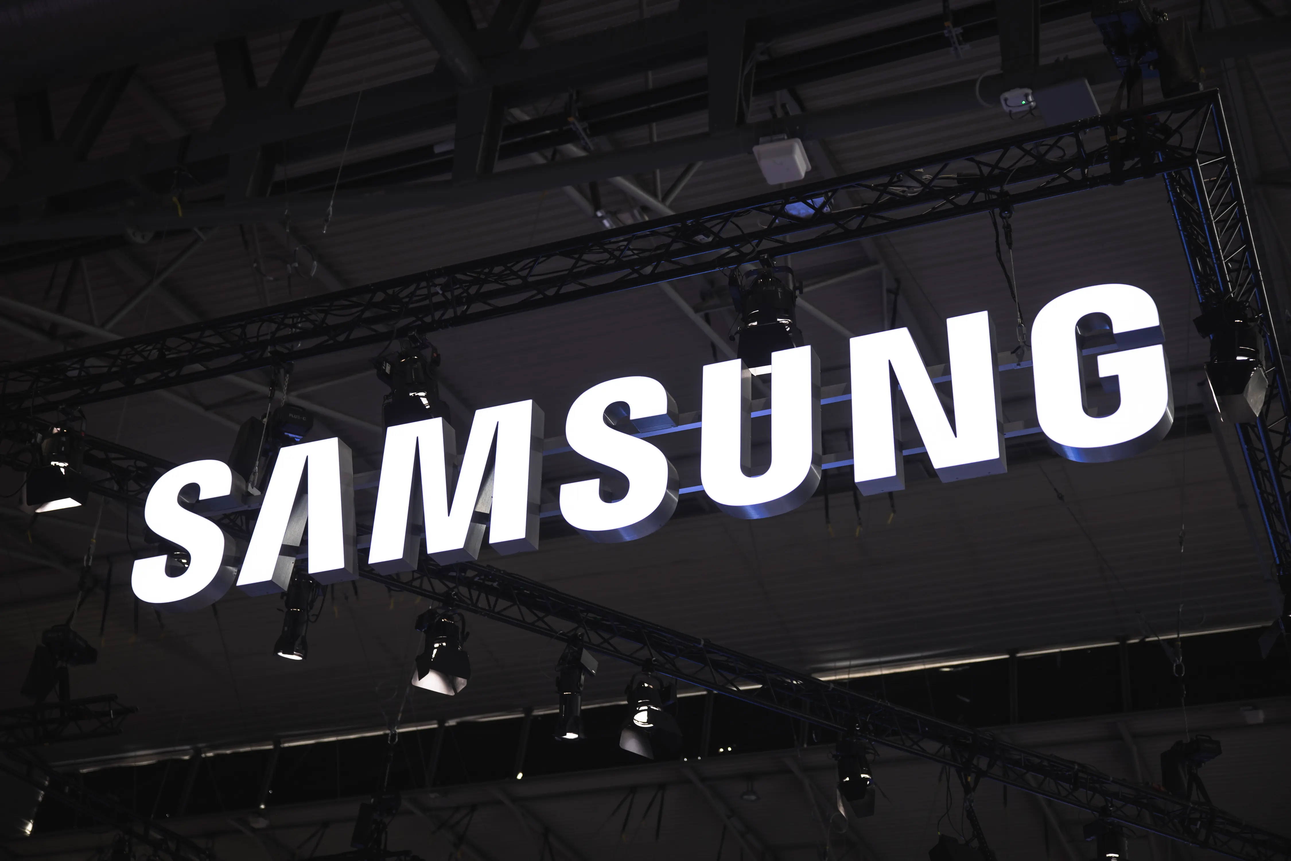 BARCELONA, SPAIN - JANUARY 30: A logo sits illuminated outside the Samsung booth at ISE 2024 on January 30, 2024 in Barcelona, Spain. This year the 20th edition of Integrated Systems Europe (ISE) is being held, the sixth in Barcelona. The hall occupies the entire surface of the Fira Gran Via exhibition center with 82,000 square meters, 30% more than last year. This year there are 1,340 exhibitors and more than 90,000 visitors are expected to attend. (Photo by Cesc Maymo/Getty Images)