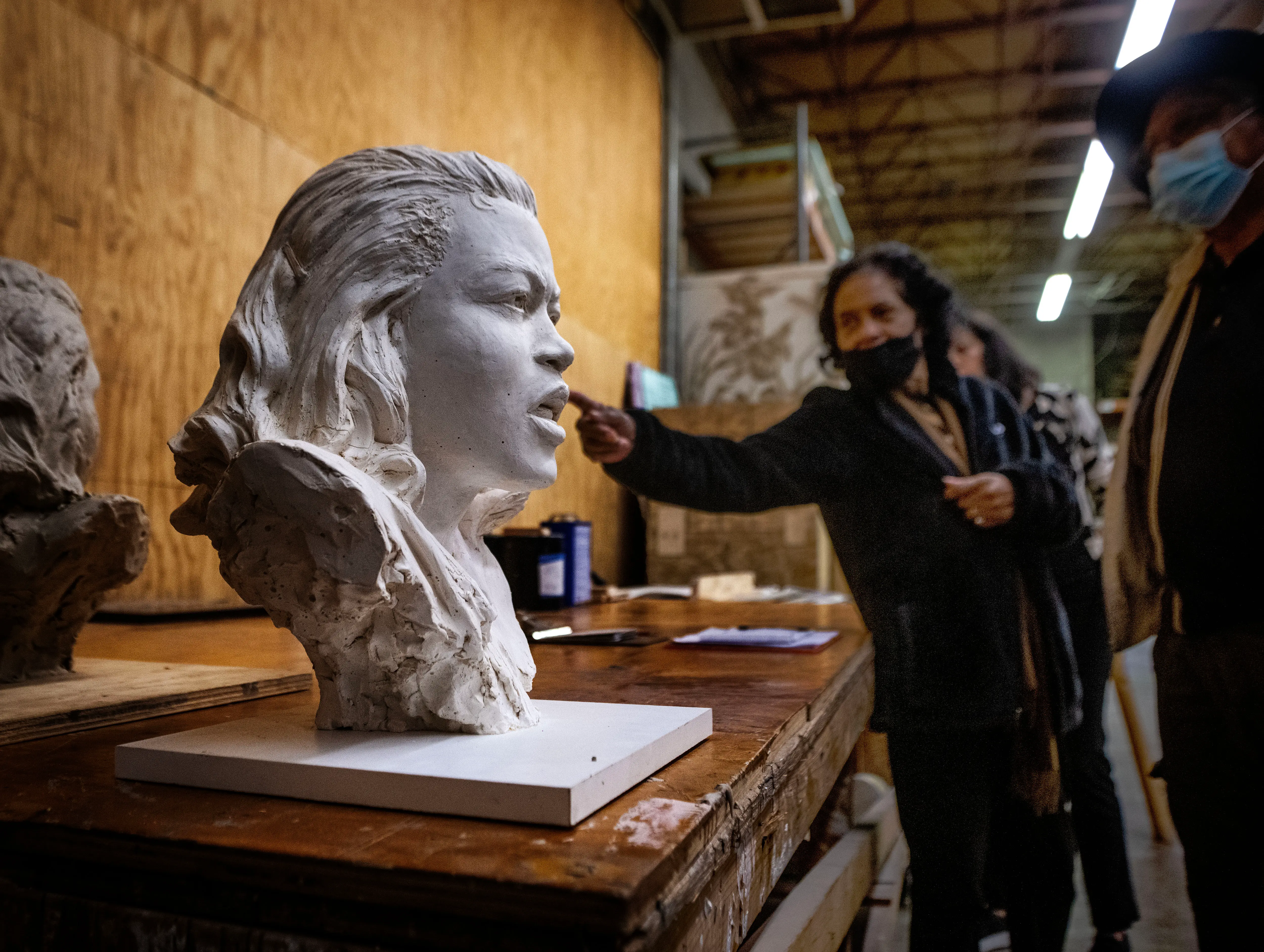 MT. RANIER, MD - MARCH 24: Family members of the late Barbara Rose Johns study versions of her likeness sculpted by Steven Weitzman, who is sculpting a statue of her to replace Robt. E. Lee in the Capitol, in his studio  in Mt. Ranier, MD. (Photo by Bill O'Leary/The Washington Post via Getty Images)