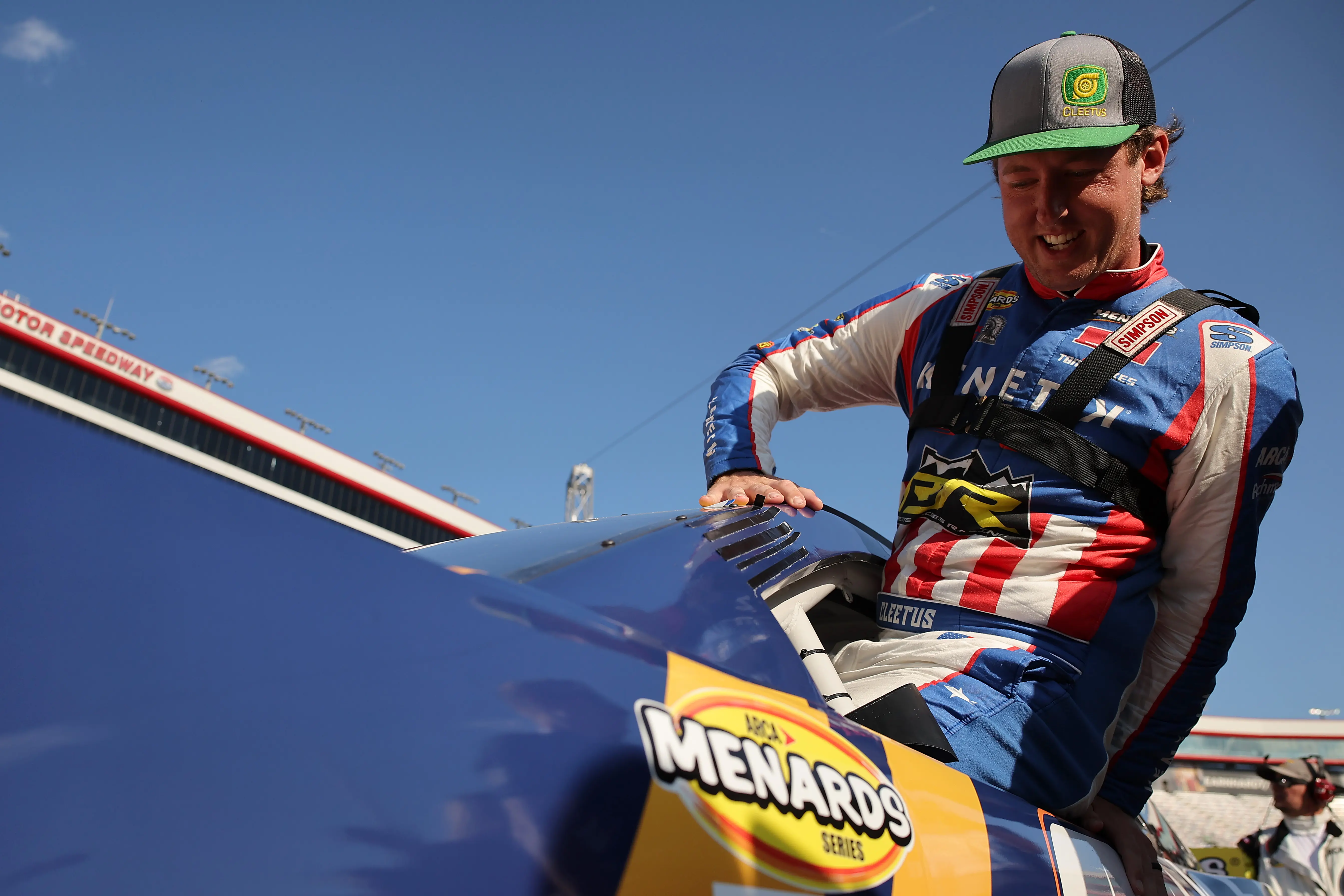 BRISTOL, TENNESSEE - SEPTEMBER 11: Garrett Mitchell, also known as Cleetus McFarland, driver of the #30 Kenetik Ford enters his car for the ARCA Menards Series Bush's Beans 200 at Bristol Motor Speedway on September 11, 2025 in Bristol, Tennessee. (Photo by Jonathan Bachman/Getty Images)