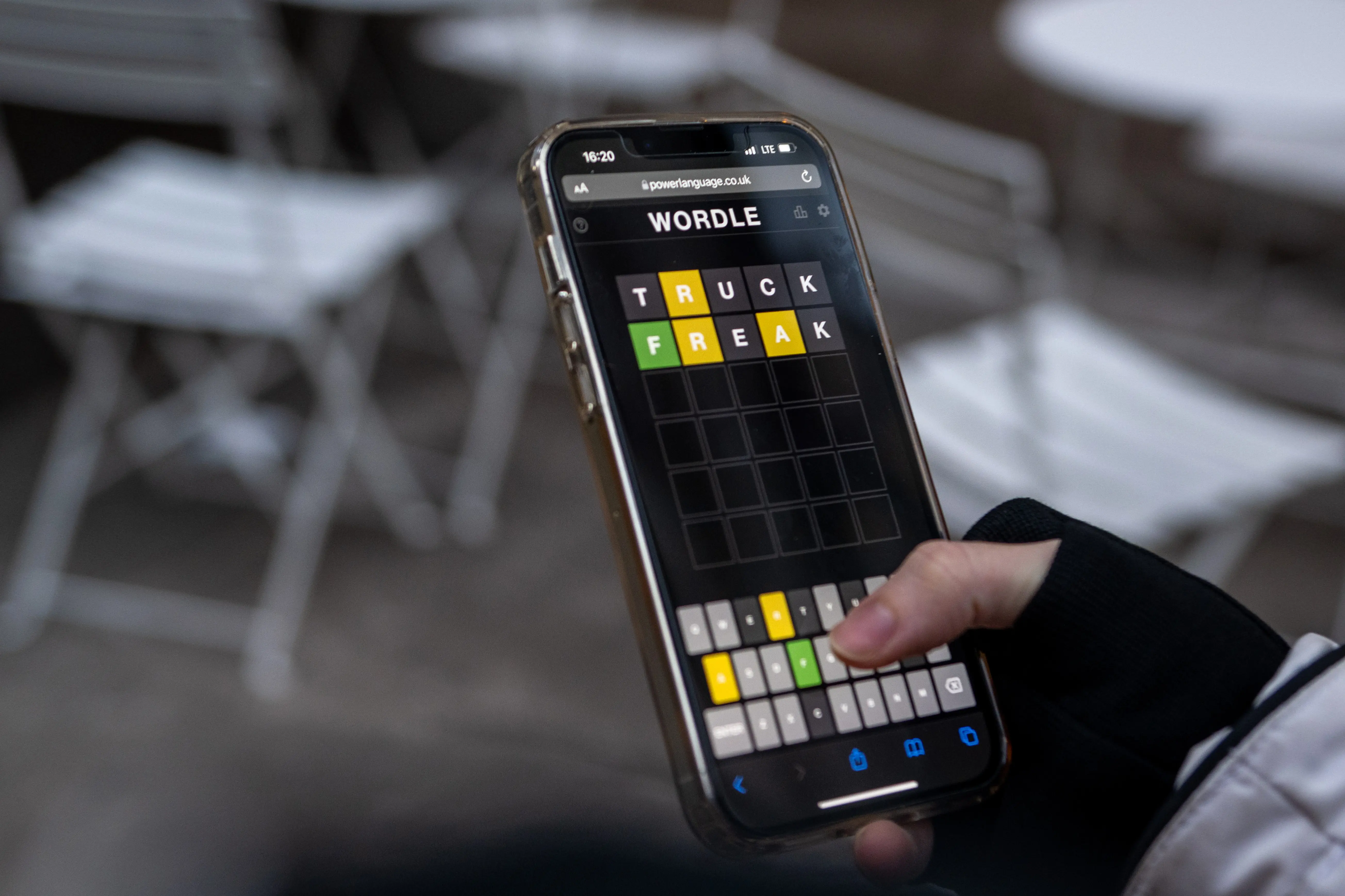 NEW YORK, NEW YORK - JANUARY 12: A friend of the photographer plays "Wordle" on January 12, 2022 in New York City. Created by Josh Wardle, Wordle, which is a spin off his name,  is a five letter word guessing game that gives the user six tries to guess the word correctly and is changed daily. It gained traction worldwide in October but recently grew even larger, with more than 2.7 million users according to NPR's Morning Edition. It features a coded way of sharing how many tries a user needed to guess correctly, using a yellow, green, and black square system when sharing it with friends or social media. (Photo by Alexi Rosenfeld/Getty Images)