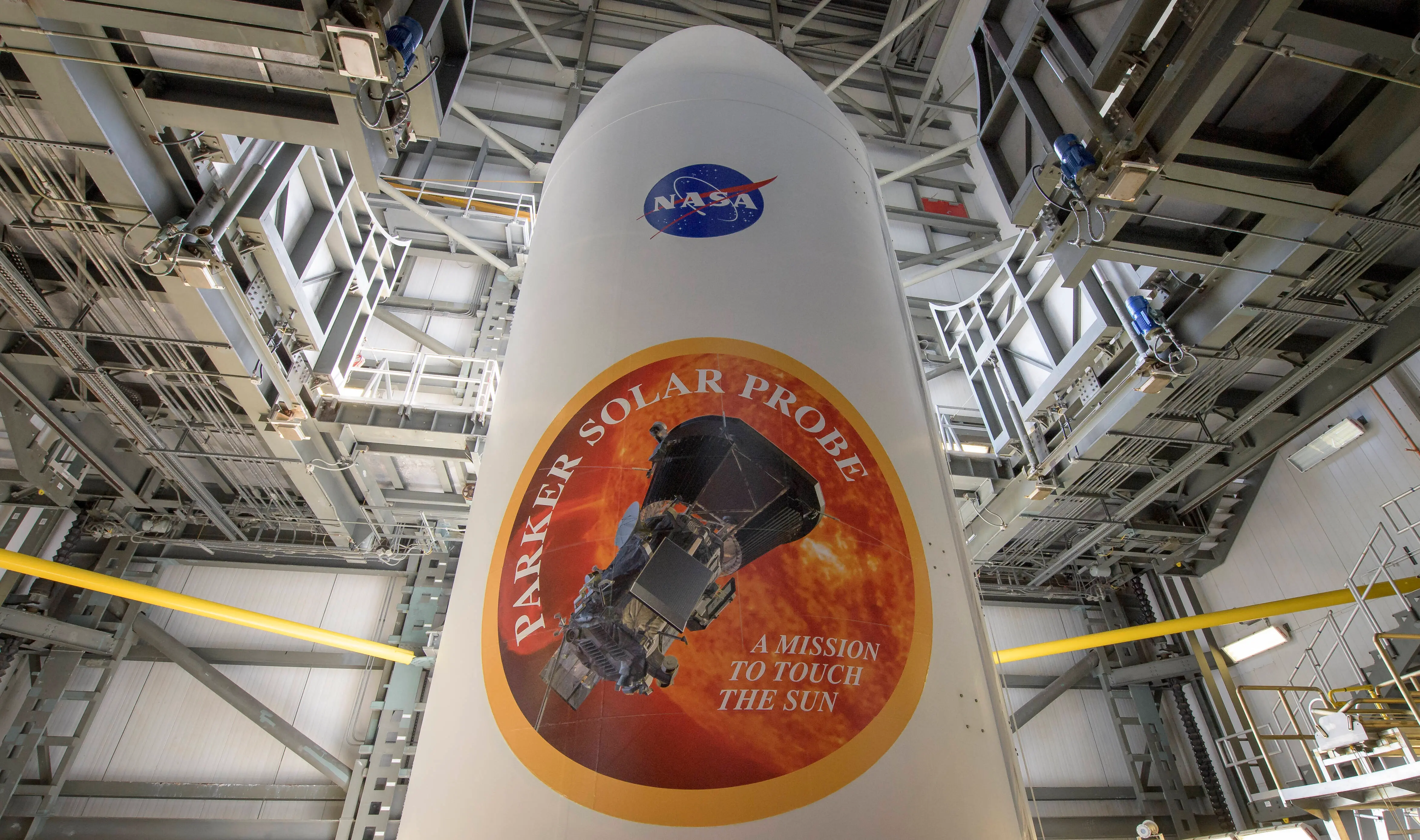 In this NASA handout,  The United Launch Alliance Delta IV Heavy rocket payload fairing is seen with the NASA and Parker Solar Probe emblems, August  8, 2018 at Launch Complex 37, Cape Canaveral Air Force Station, Florida. Parker Solar Probe will travel through the Suns atmosphere, closer to the surface than any spacecraft before it (Image via Getty)