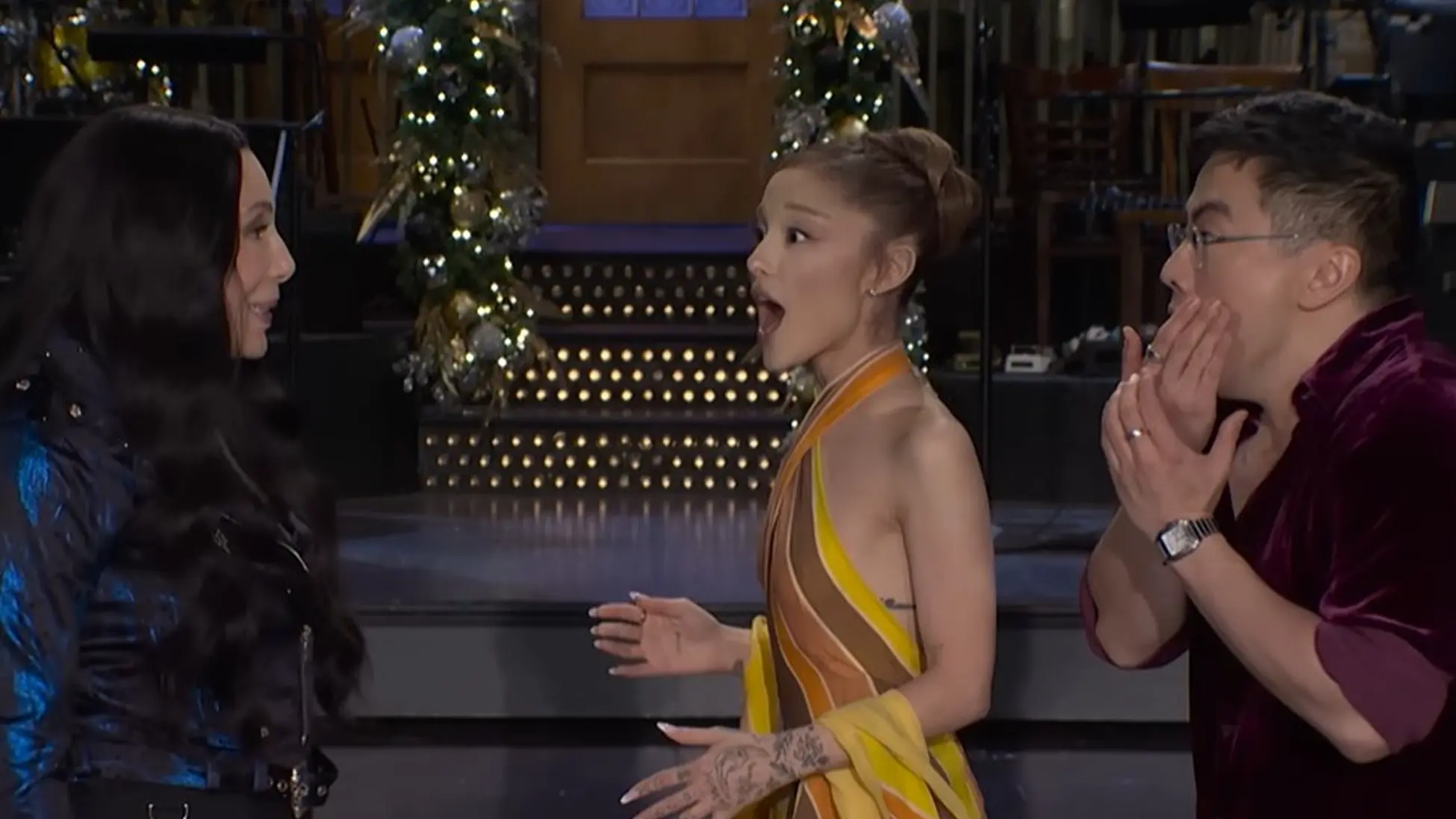 Cher slaps  Ariana Grande and Bowen Yang in a SNL Promo. (Image via youtube/@Saturday Night Live)