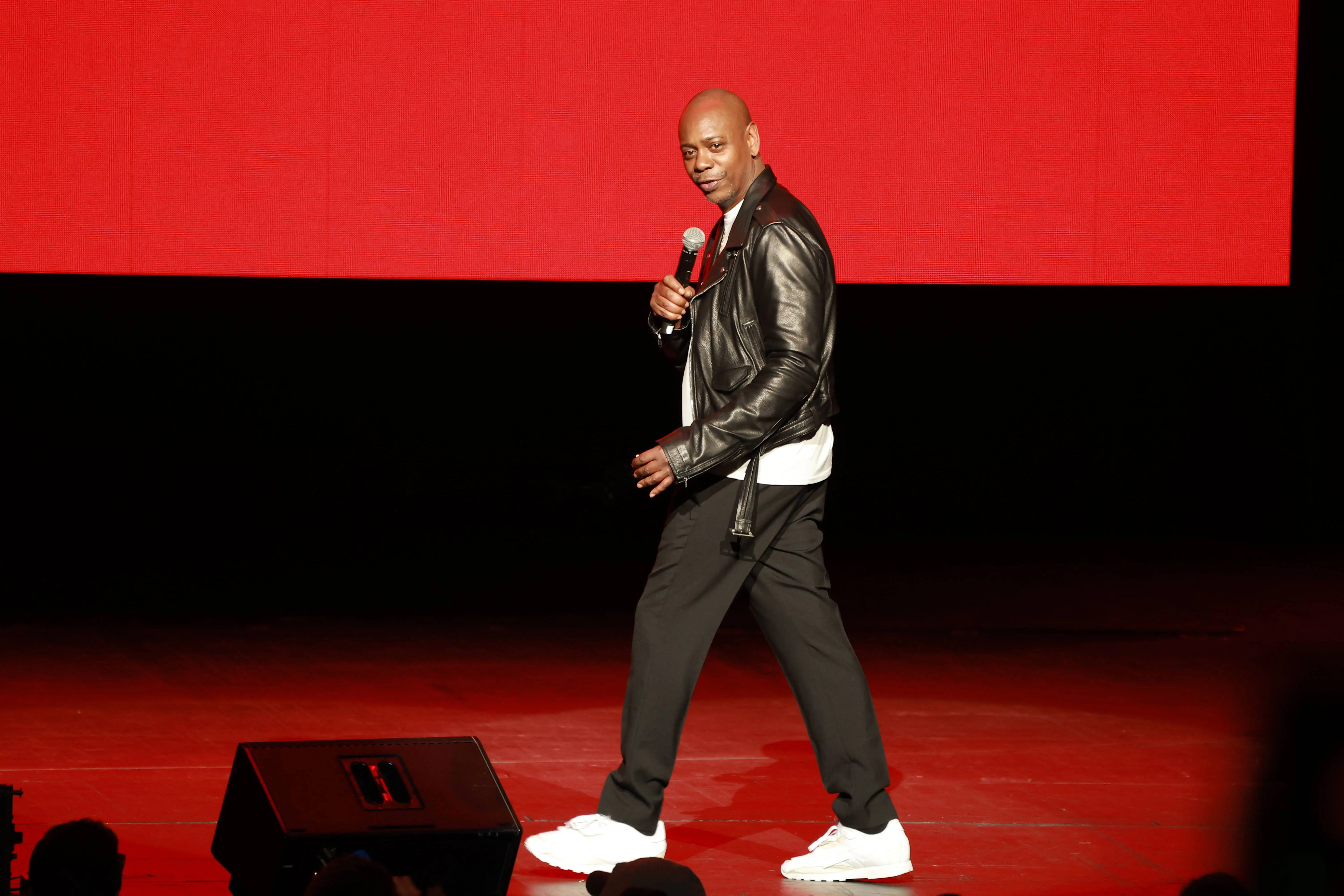 NEW YORK, NY - OCTOBER 16: Dave Chappelle performs during a midnight pop-up show at Radio City Music Hall on October 16, 2022 in New York City. (Photo by Jason Mendez/Getty Images for ABA)