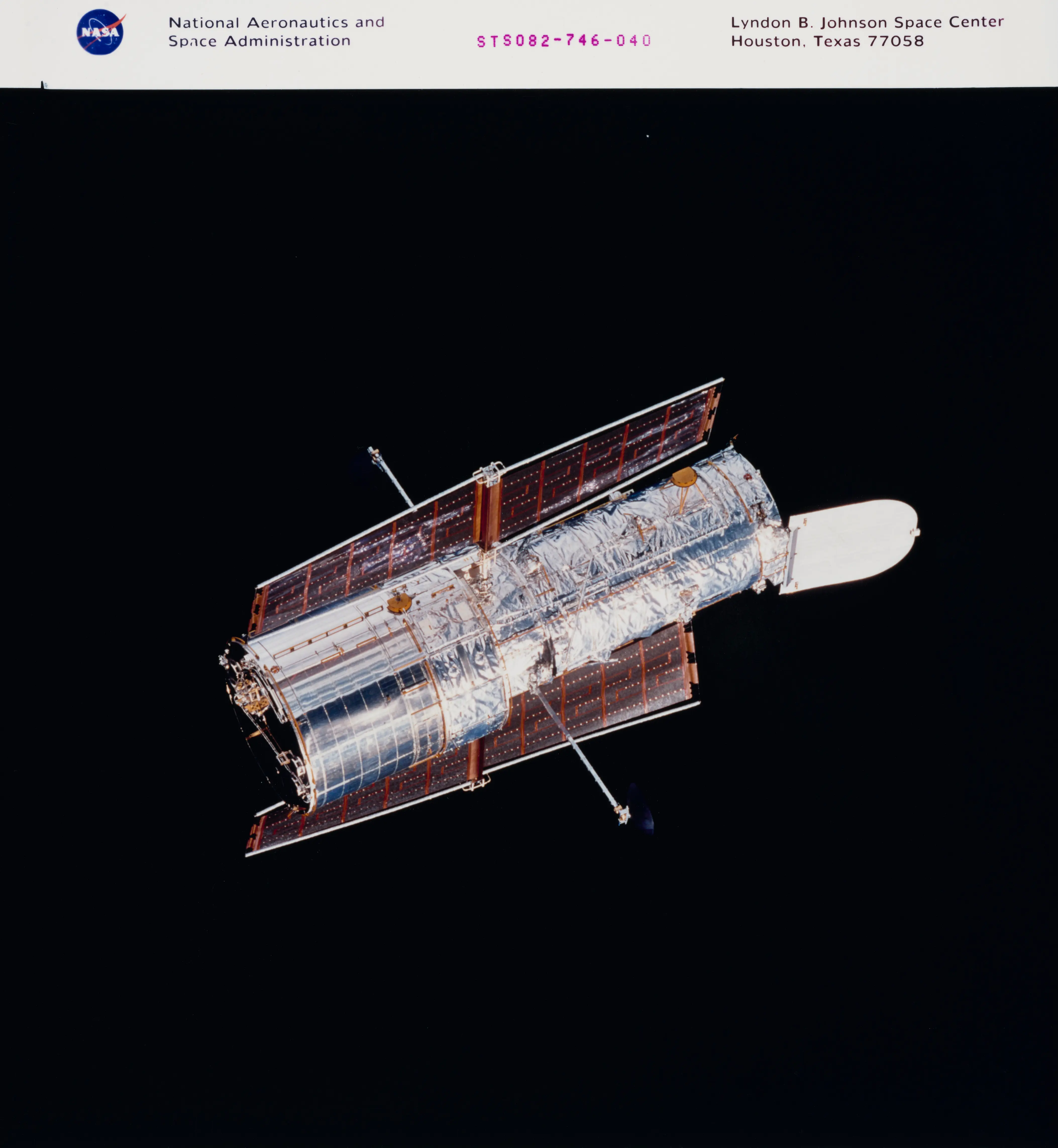 Suspended in the dark vastness of space, the Hubble Space Telescope (HST) continues its separation from the Space Shuttle Discovery following its release from the cargo bay (Image via Getty)