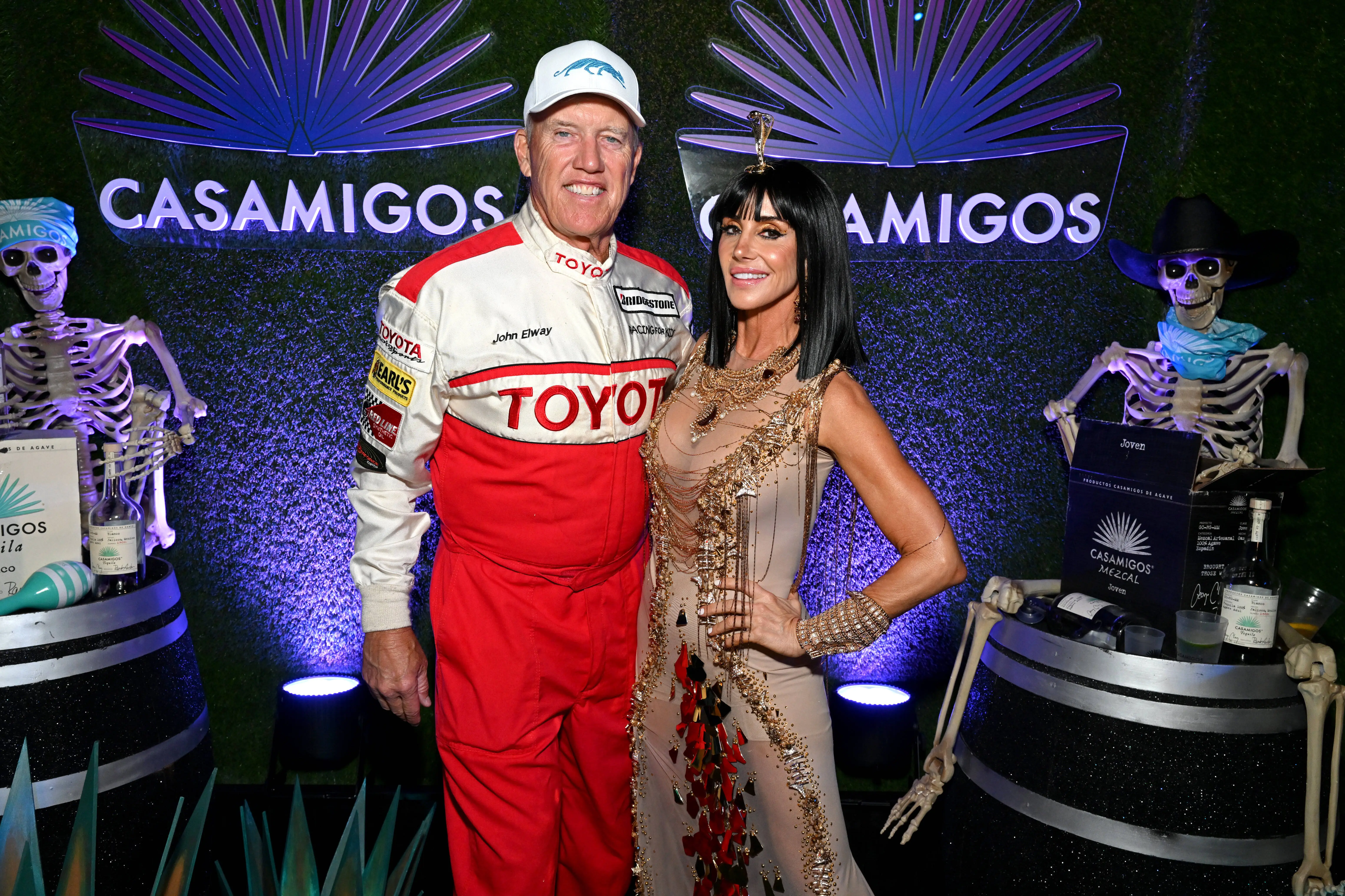 John Elway and Paige Elway attend the Casamigos Halloween Party Returns in Beverly Hills (Image via Getty)