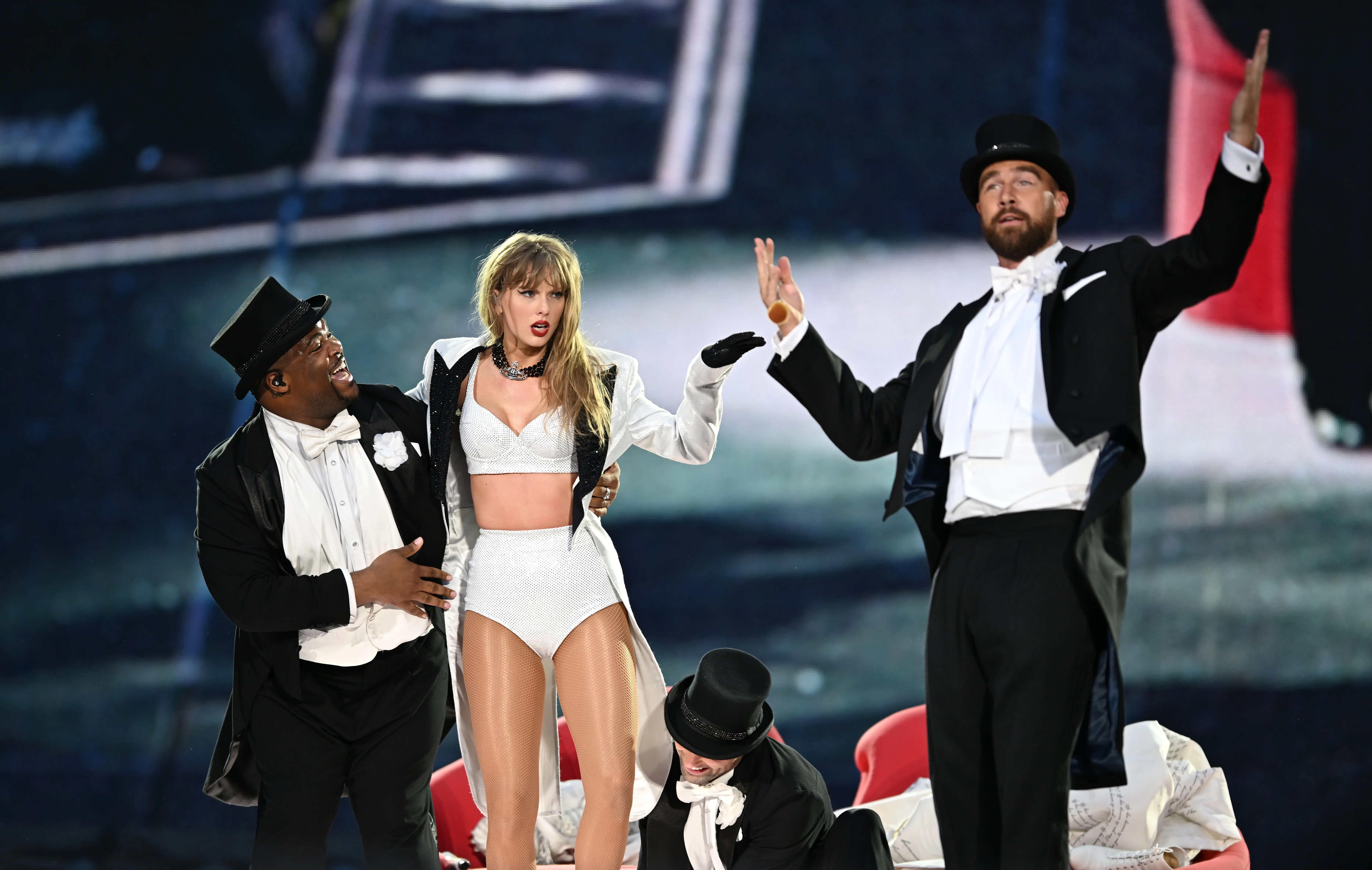LONDON, ENGLAND - JUNE 23: (EDITORIAL USE ONLY. NO STANDALONE PUBLICATION USE (NO SPECIAL INTEREST OR SINGLE ARTIST PUBLICATION USE; NO BOOK USE)) EXCLUSIVE ACCESS. Taylor Swift is joined on stage by Travis Kelce (R), during "Taylor Swift | The Eras Tour" at Wembley Stadium on June 23, 2024 in London, England. (Photo by Gareth Cattermole/TAS24/Getty Images for TAS Rights Management )