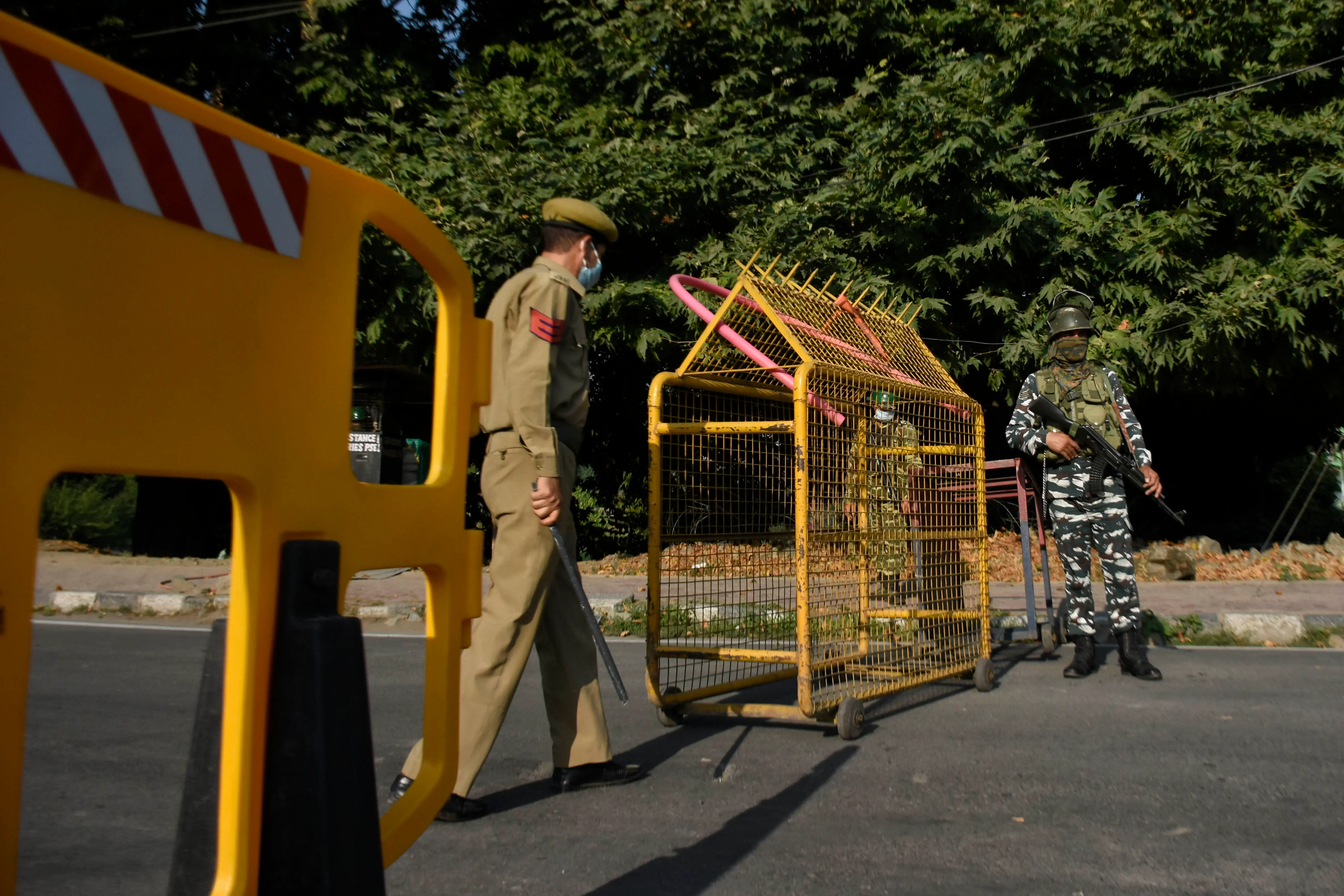 Indian paramillitary troopers stands alert during strict restrictions in Srinagar, Indian Administered Kashmir on 05 August 2020. Restrictions were placed in place on the first anniversary of revocation of Article 370 by Indian government to tackle any protests. (Photo by Muzamil Mattoo/NurPhoto via Getty Images)