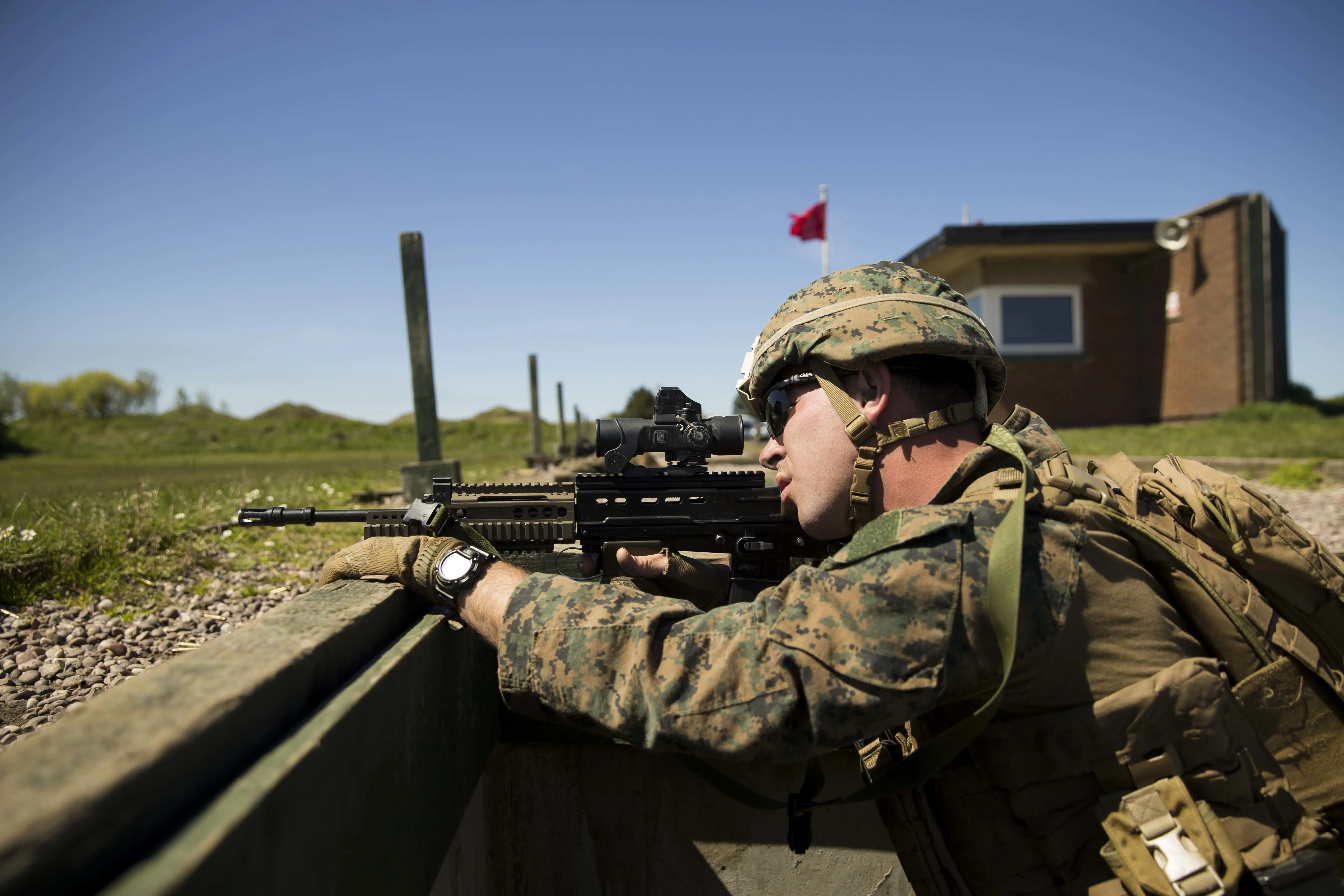 Photograph of US Corporal William Ring using an SA80 A2 assault rifle during the British Royal Marine Operational Shooting Competition held at Altcar Training Camp, Hightown, England, May 14, 2018. (Photo by Smith Collection/Gado/Getty Images)