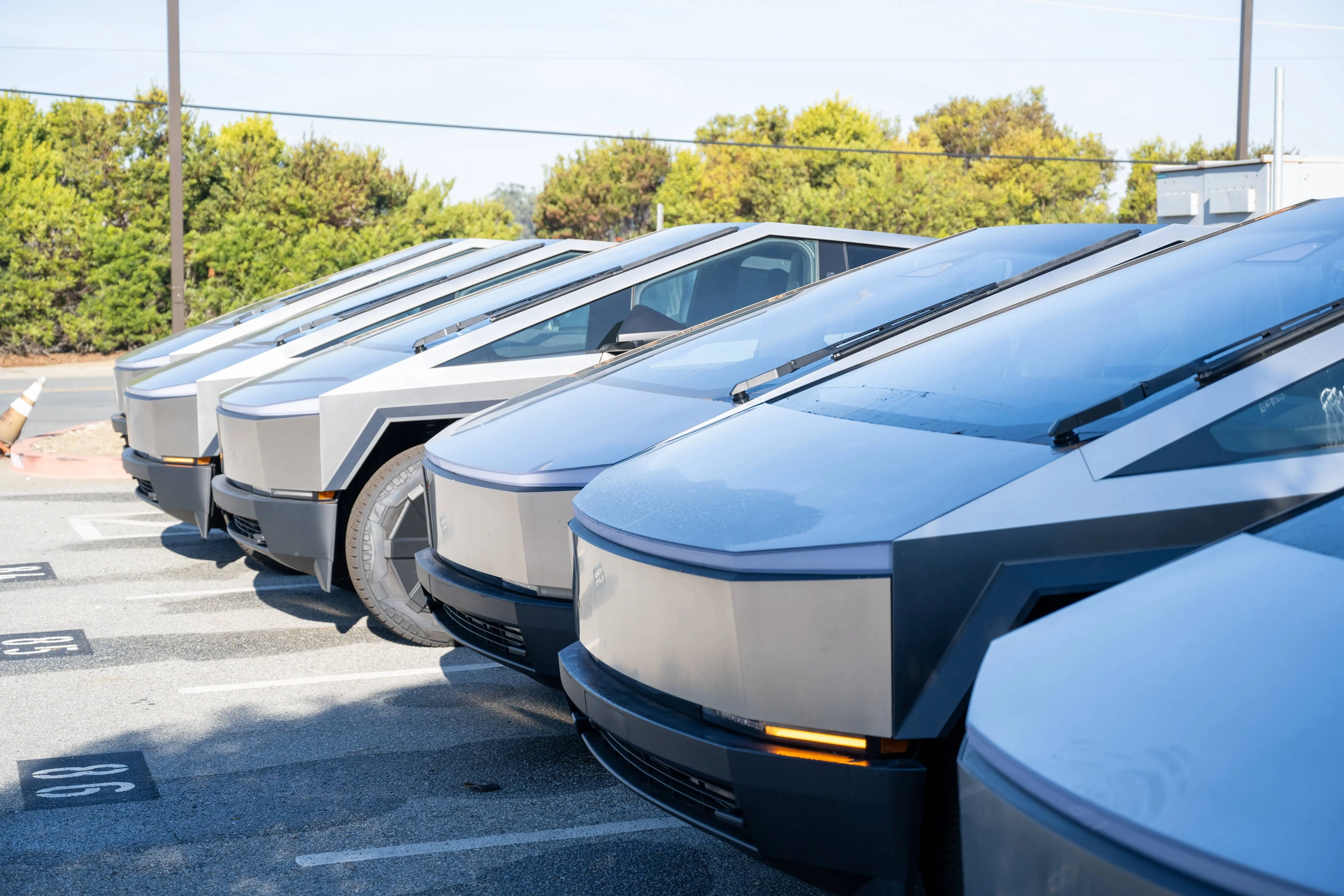 Line of multiple Tesla Cybertrucks at Tesla Motors dealership in Colma, California, December 6, 2024. (Photo by Smith Collection/Gado/Getty Images)