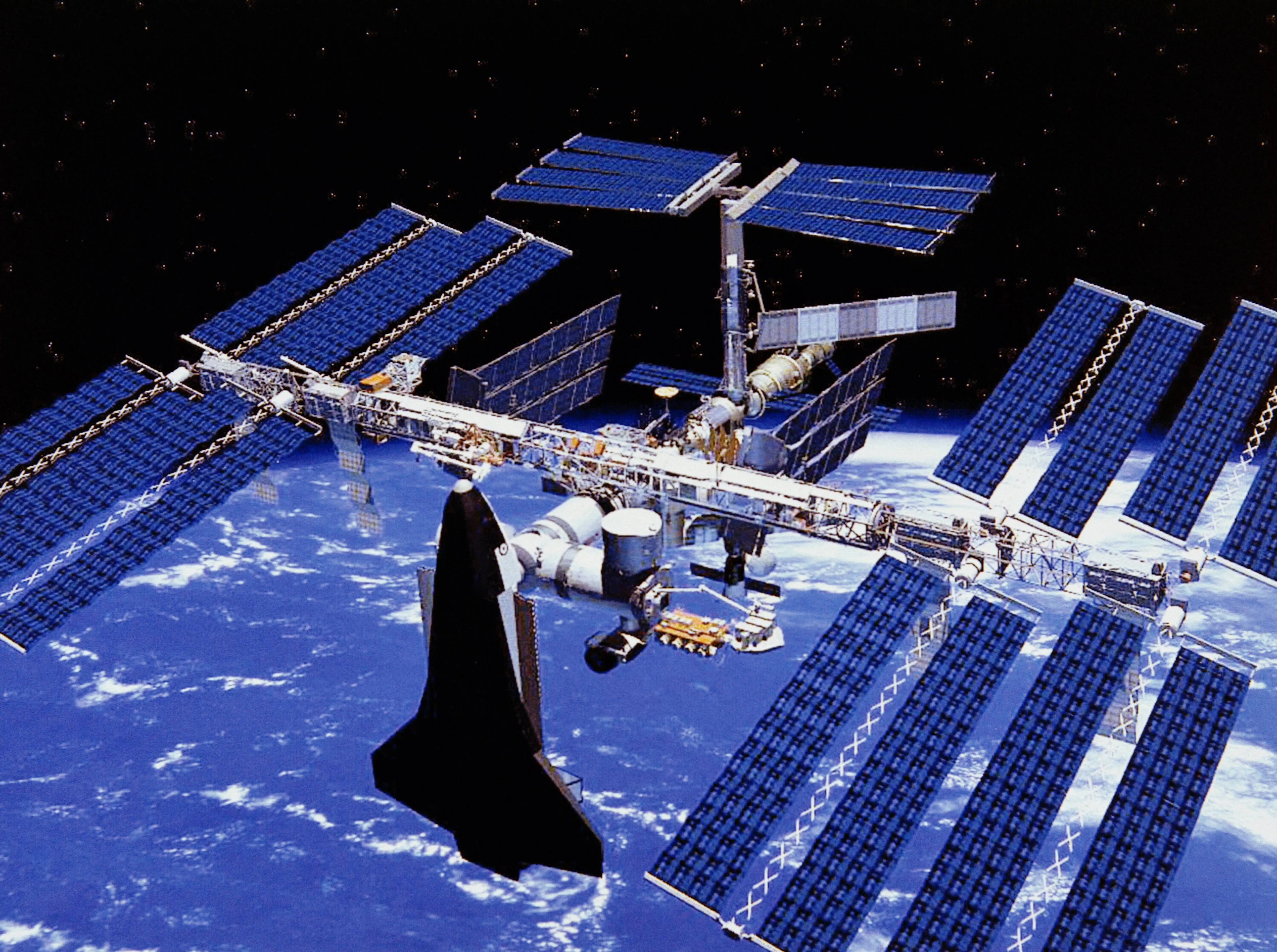 An artist's impression of a NASA Space Shuttle docked at the completed International Space Station (Image via Getty)