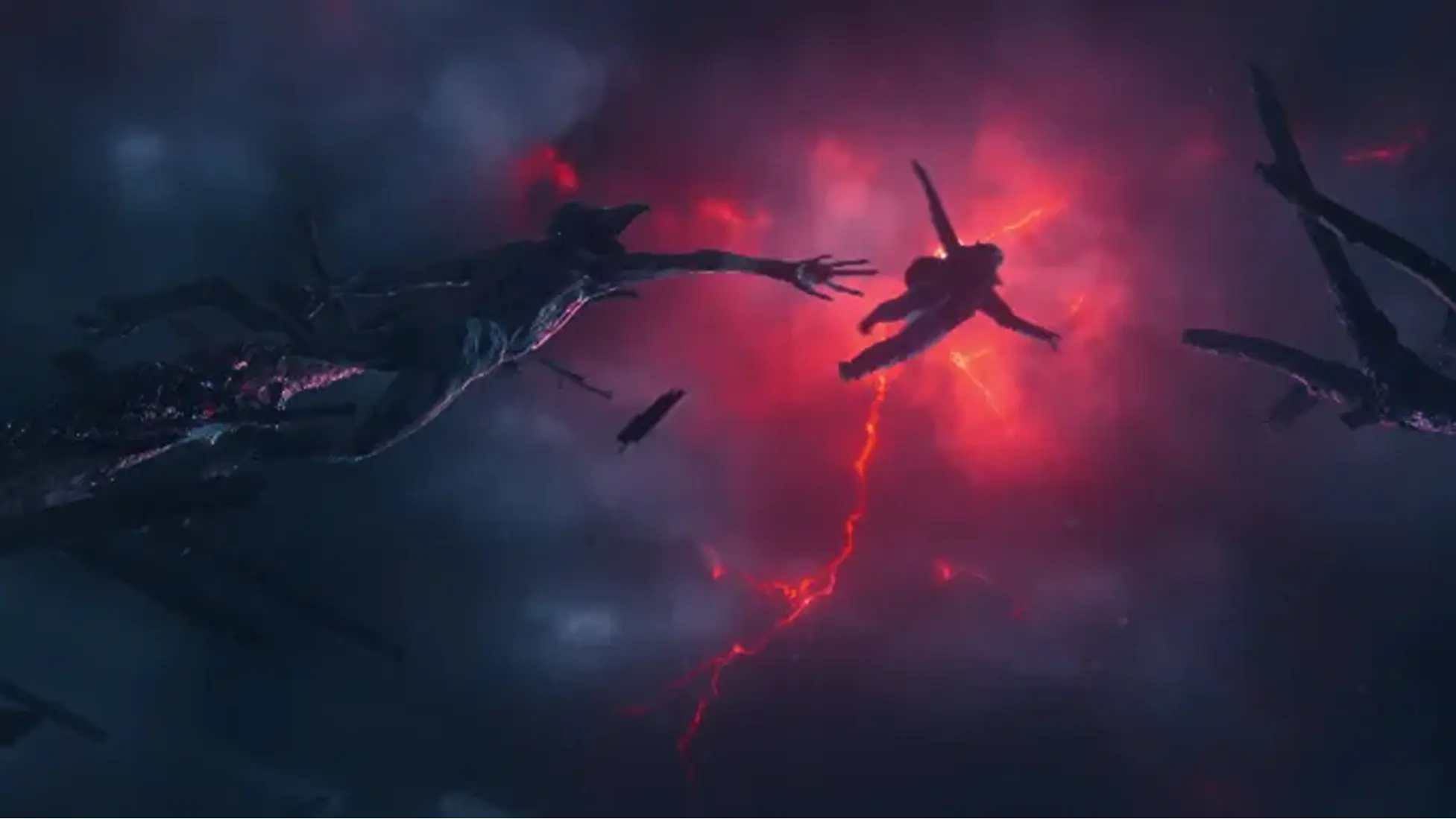 Luke Kokotek as Young Will Byers drift through a red-lit rift as the Upside Down crackles with energy in STRANGER THINGS: SEASON 5 . Image via Netflix.