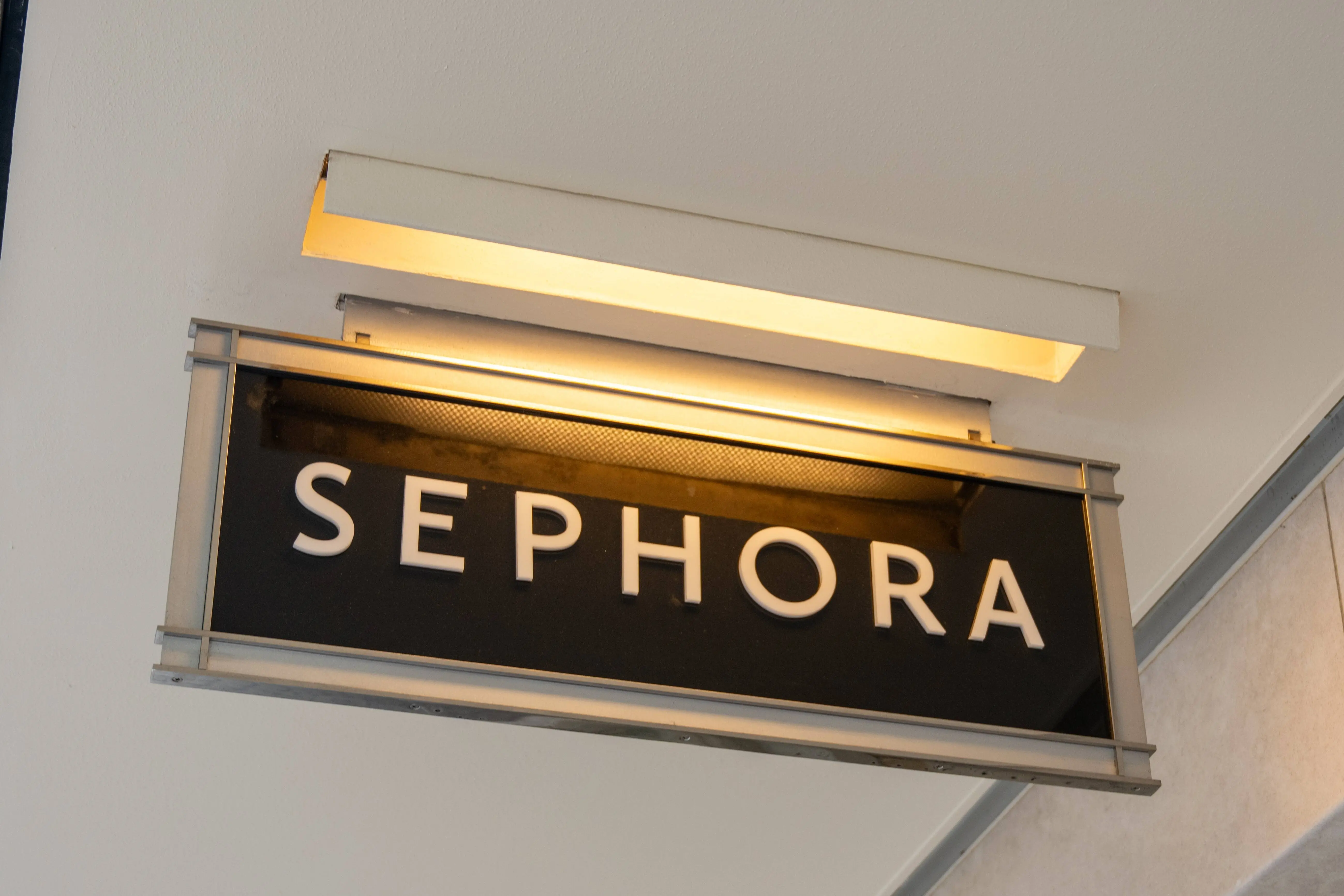 Illuminated hanging Sephora store sign under ceiling overhang, San Francisco, California, August 14, 2025. (Photo by Smith Collection/Gado/Getty Images)