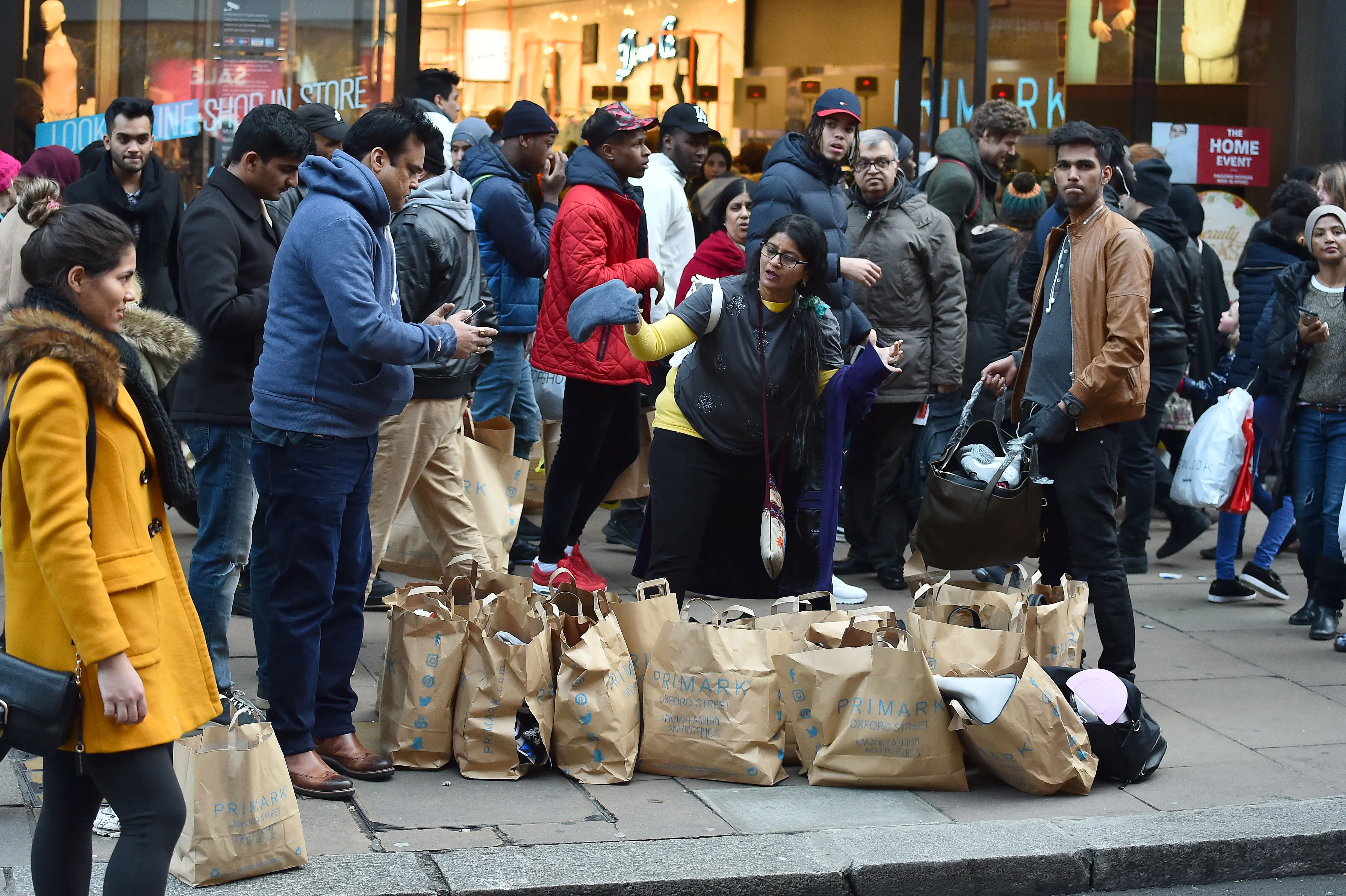 LONDON, ENGLAND - DECEMBER 26:  Shoppers on Oxford Street hit the Boxing Day Sales on December 26, 2017 in London, England. According to reports, a decrease for in-store shopping is expected while online purchases are rising during after Christmas sales. (Photo by HGL/Getty Images)