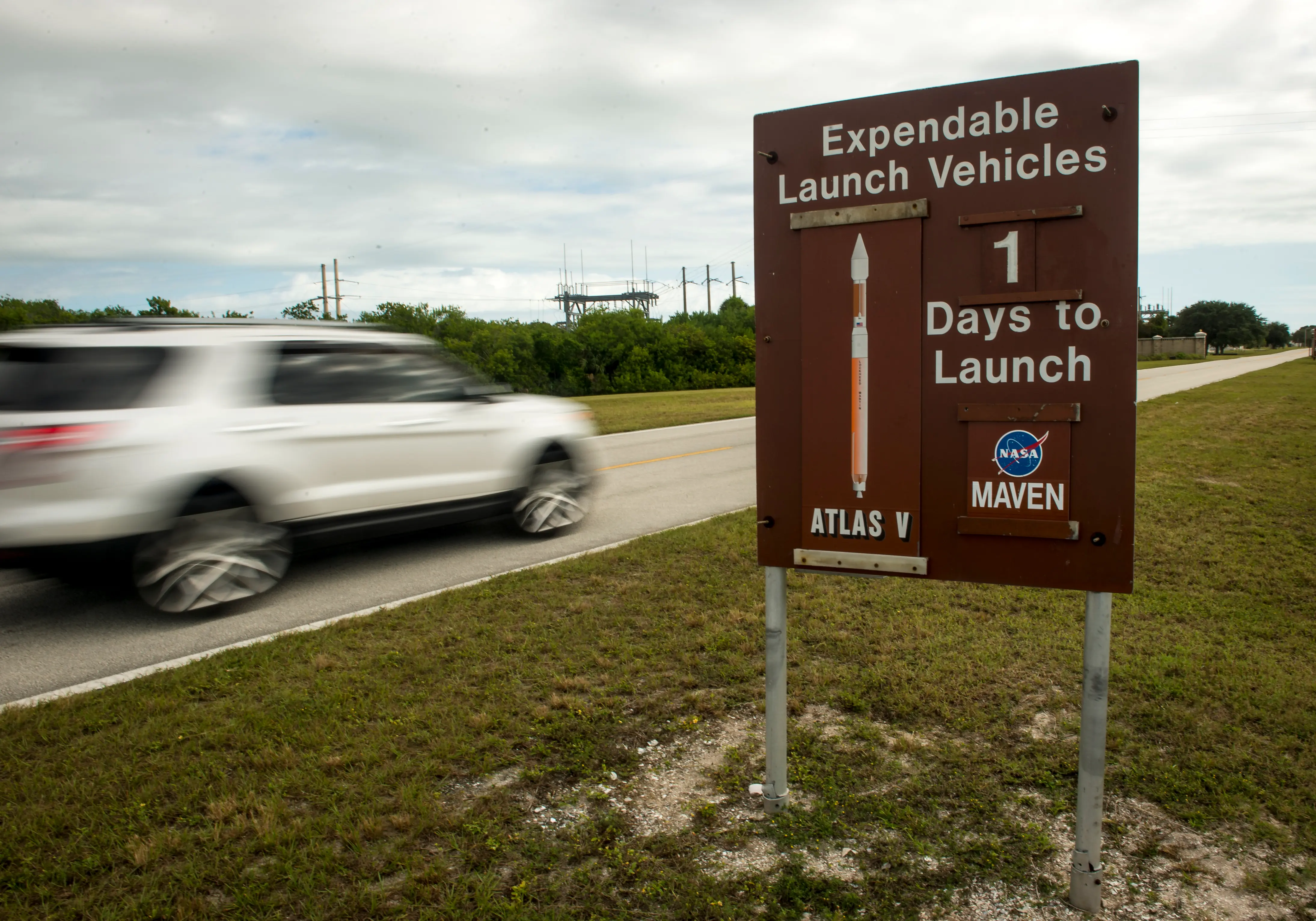 In this handout photo provided by NASA, a sign along the NASA Kennedy Space Center causeway displays to passersby that there is one day remaining until the scheduled launch of the United Launch Alliance Atlas V rocket with NASA's Mars Atmosphere and Volatile Evolution (MAVEN) spacecraft onboard from Cape Canaveral Air Force Station Space Launch Complex 41 November 17, 2013 in Cape Canaveral, Florida. The space agency's Mars Atmosphere and Volatile EvolutioN mission (MAVEN for short) is on a mission to study the upper atmosphere of Mars in hopes to discover how the planet lost most of its atmosphere and liquid water (Image via Getty)