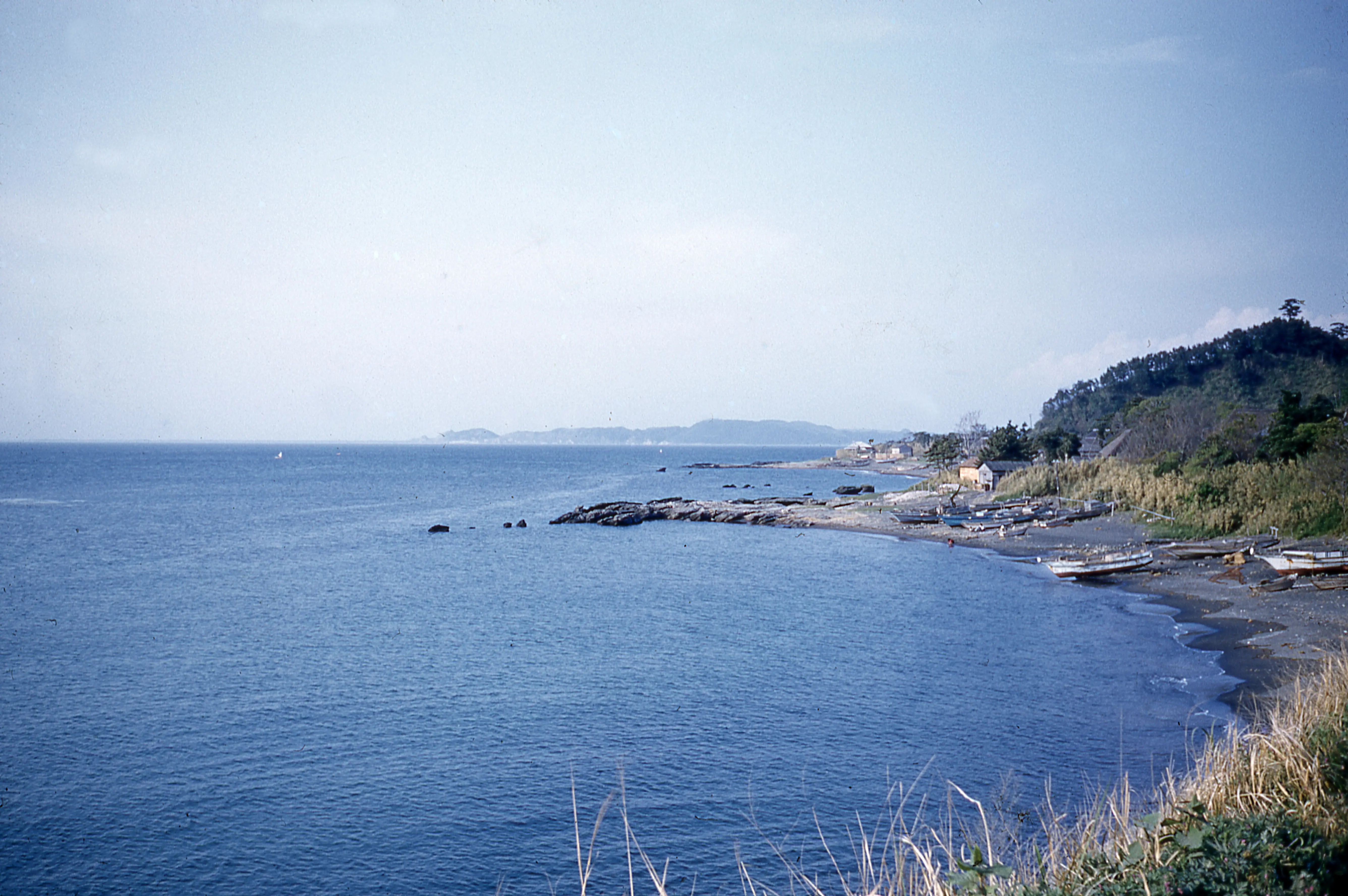 High angle view across the sea and boats lying on a beach, Japan, 1950 (Image via Getty)