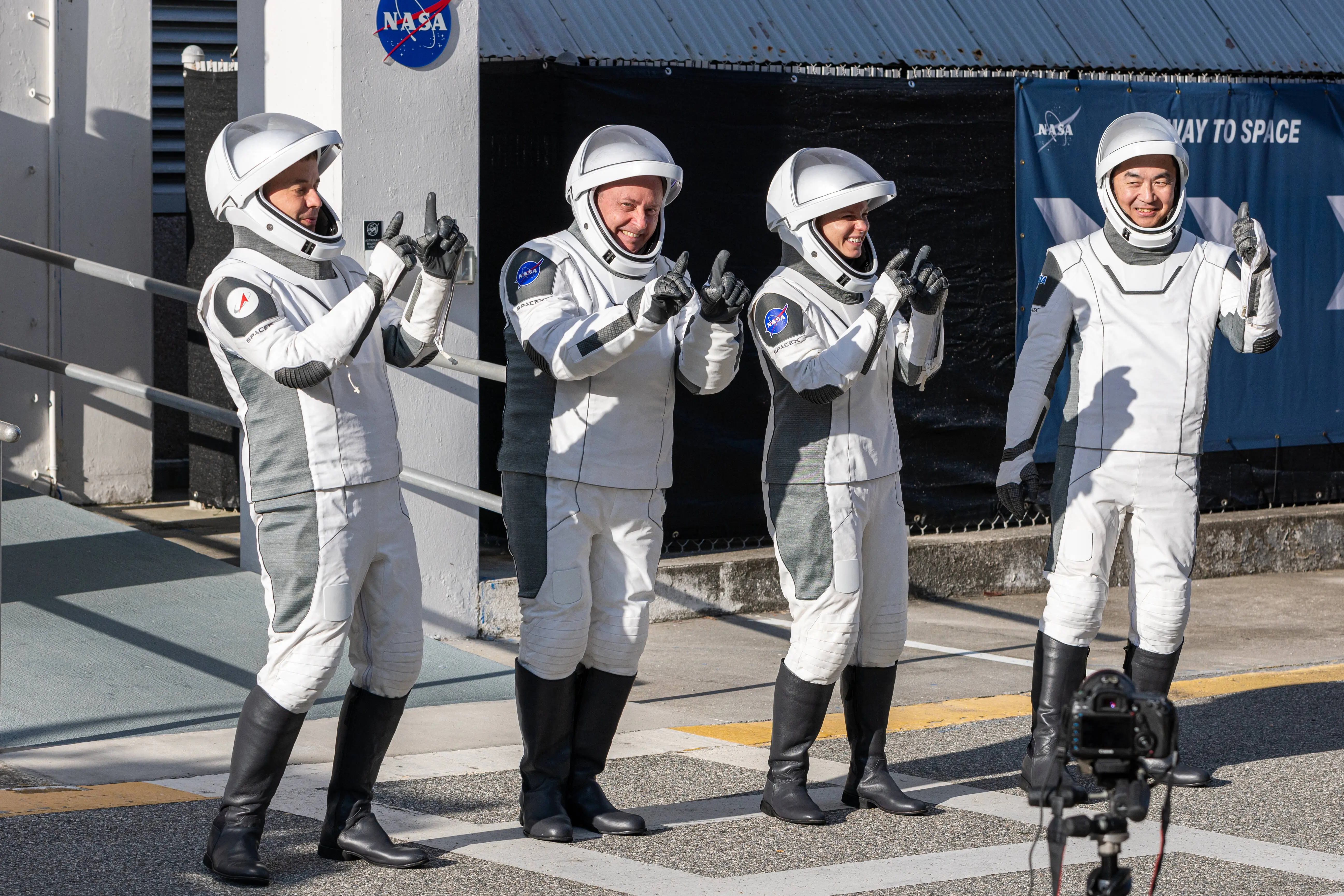 Three astronauts and one cosmonaut on the Crew-11 mission to the International Space Station board their transport vehicles to the launch pad on the second launch attempt at the Neil Armstrong Operations and Checkout Building in Kennedy Space Center, FL, on August 1, 2025 (Image via Getty)