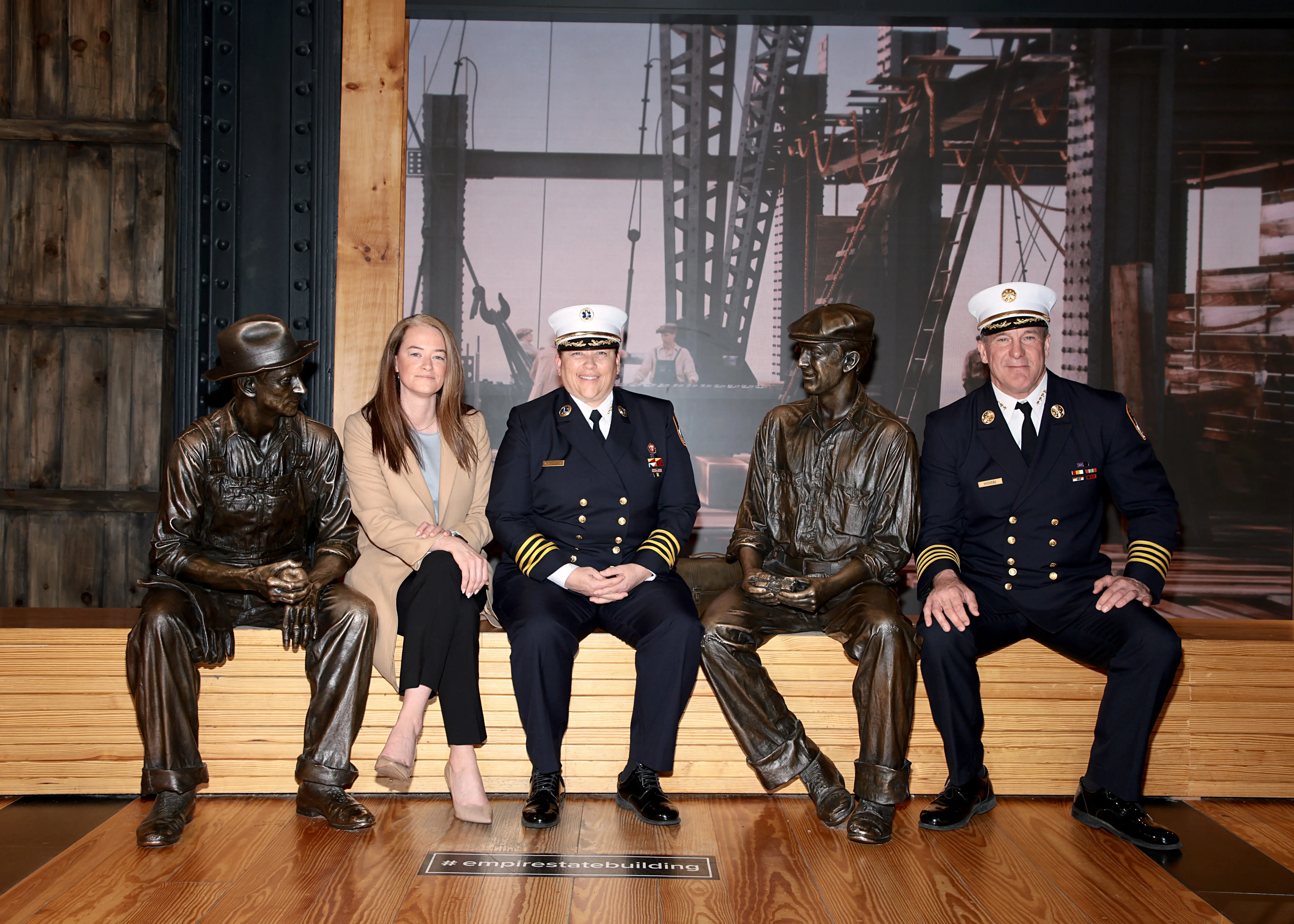 NEW YORK, NEW YORK - MAY 13: (L-R) Acting Fire Commissioner Laura Kavanagh, Lillian Bonsignore, and John Hodgens visit the Empire State Building in honor of EMS Week on May 13, 2022 in New York City. (Photo by Dimitrios Kambouris/Getty Images for Empire State Realty Trust, Inc.)