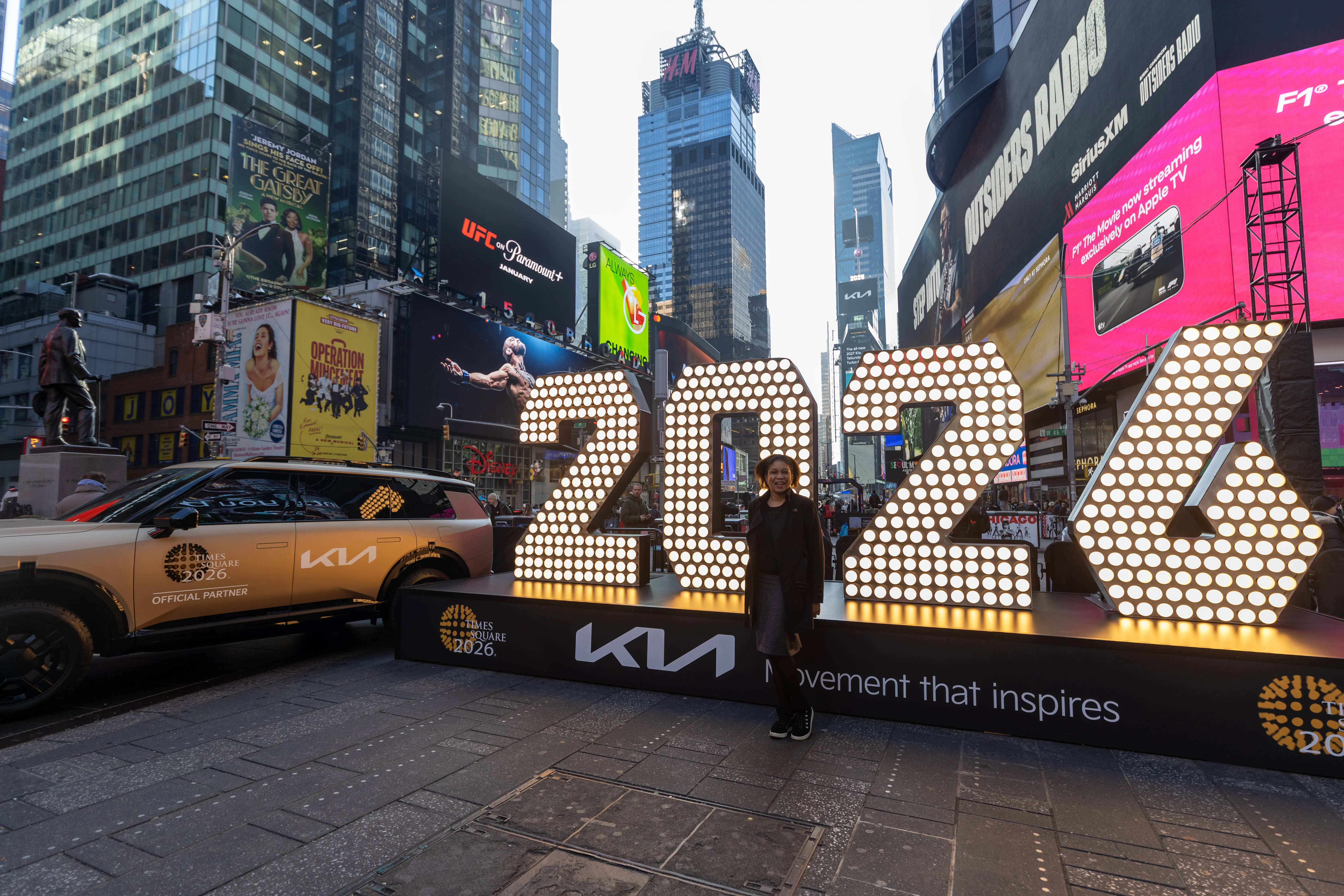 Illuminated numerals reading '2026' are displayed in Times Square in New York City, United States on December 18, 2025. A Kia vehicle, an official partner of Times Square New Yearâs Eve 2026, is positioned beside the installation, which will remain on public display through December 23 before being installed atop One Times Square ahead of New Year's Eve celebrations. (Photo by Nazli Zeynep Karabulut/Anadolu via Getty Images)