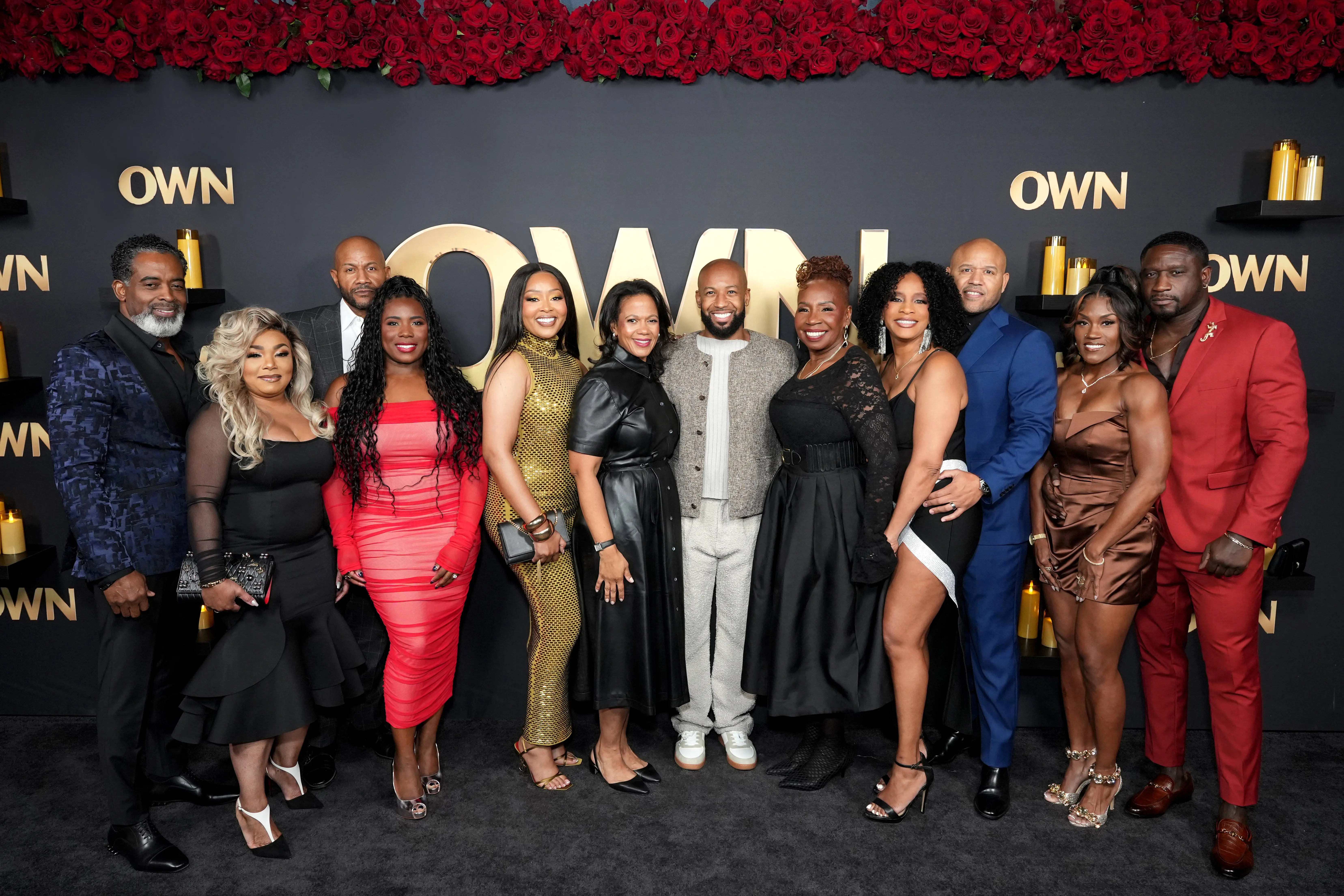 (L-R) Christopher Fletcher, Nell Fletcher, Marsau Scott, La Tisha Scott, Destiny Peyton, President of OWN Tina Perry, Carlos King, Iyanla Vanzant, Kimmy Grant Scott, Maurice Scott, Latricia Reedus and Ken Lee attend A Night of Celebration with OWN on December 01, 2025 in Los Angeles, California (Image via Getty)
