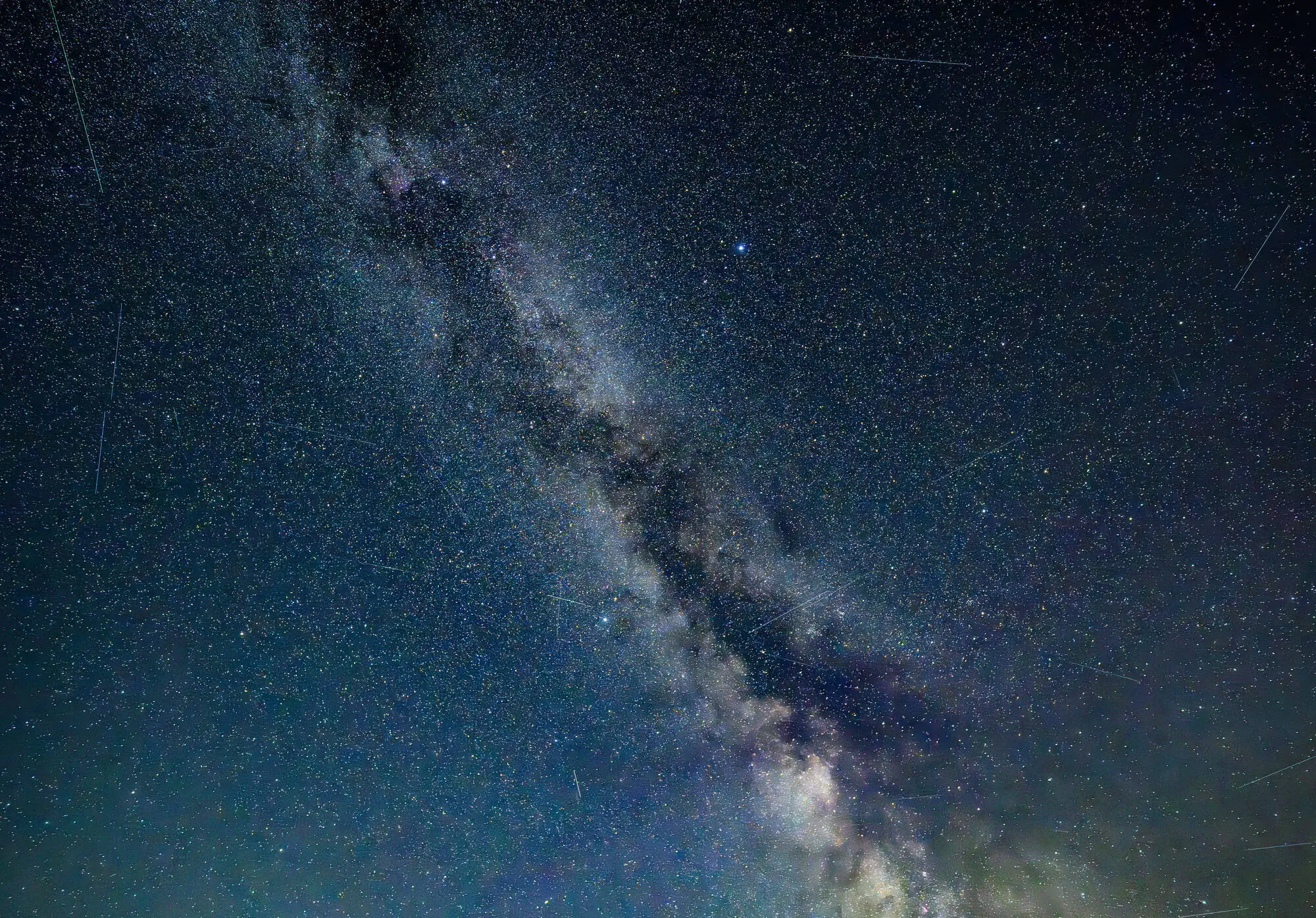 19 August 2025, Brandenburg, Lietzen: Part of the Milky Way can be seen in the starry night sky together with the light trails of passing satellites. Photo: Patrick Pleul/dpa (Image via Getty)