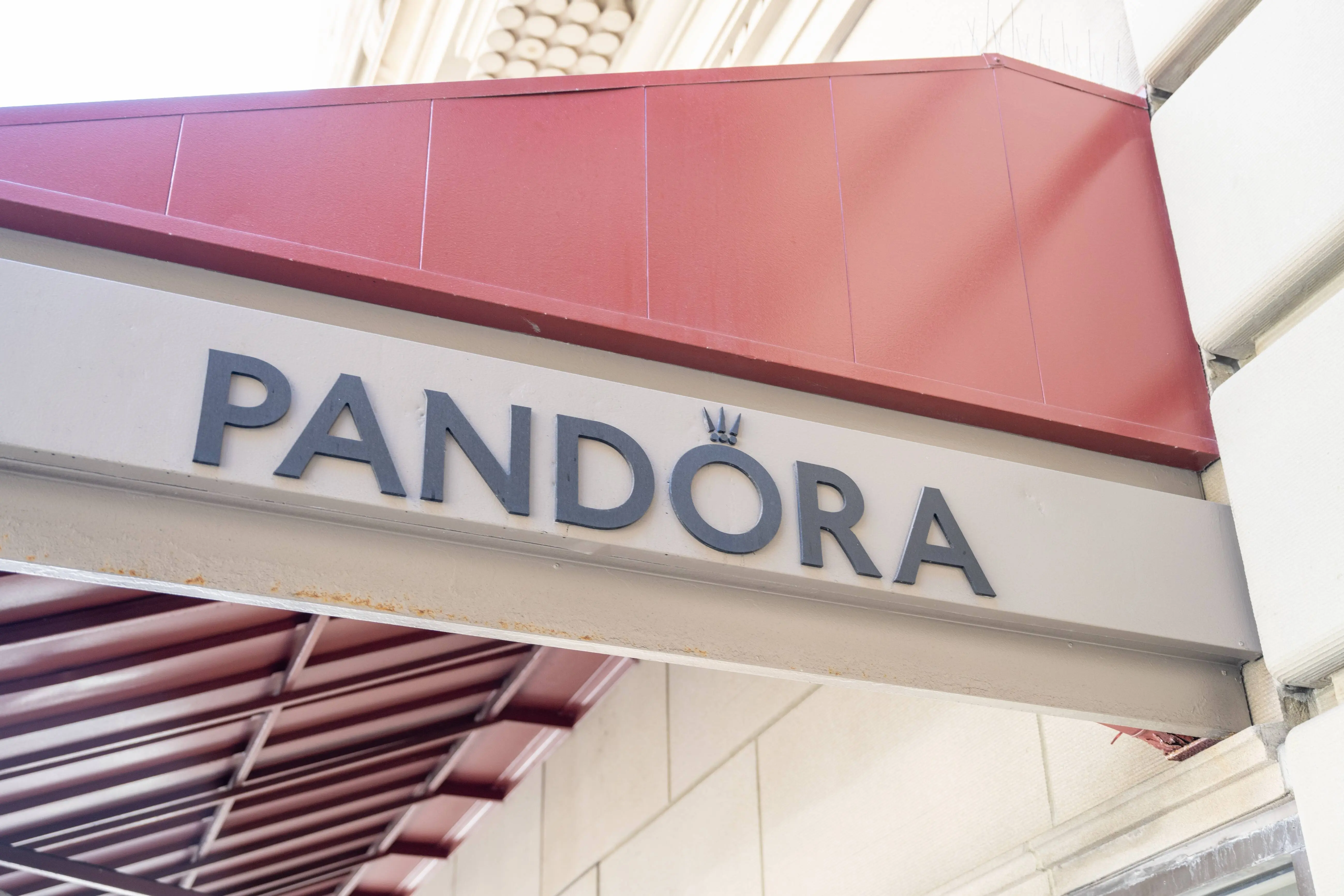 Exterior sign for Pandora jewelry store under red awning, San Francisco, California, August 19, 2025. (Photo by Smith Collection/Gado/Getty Images)