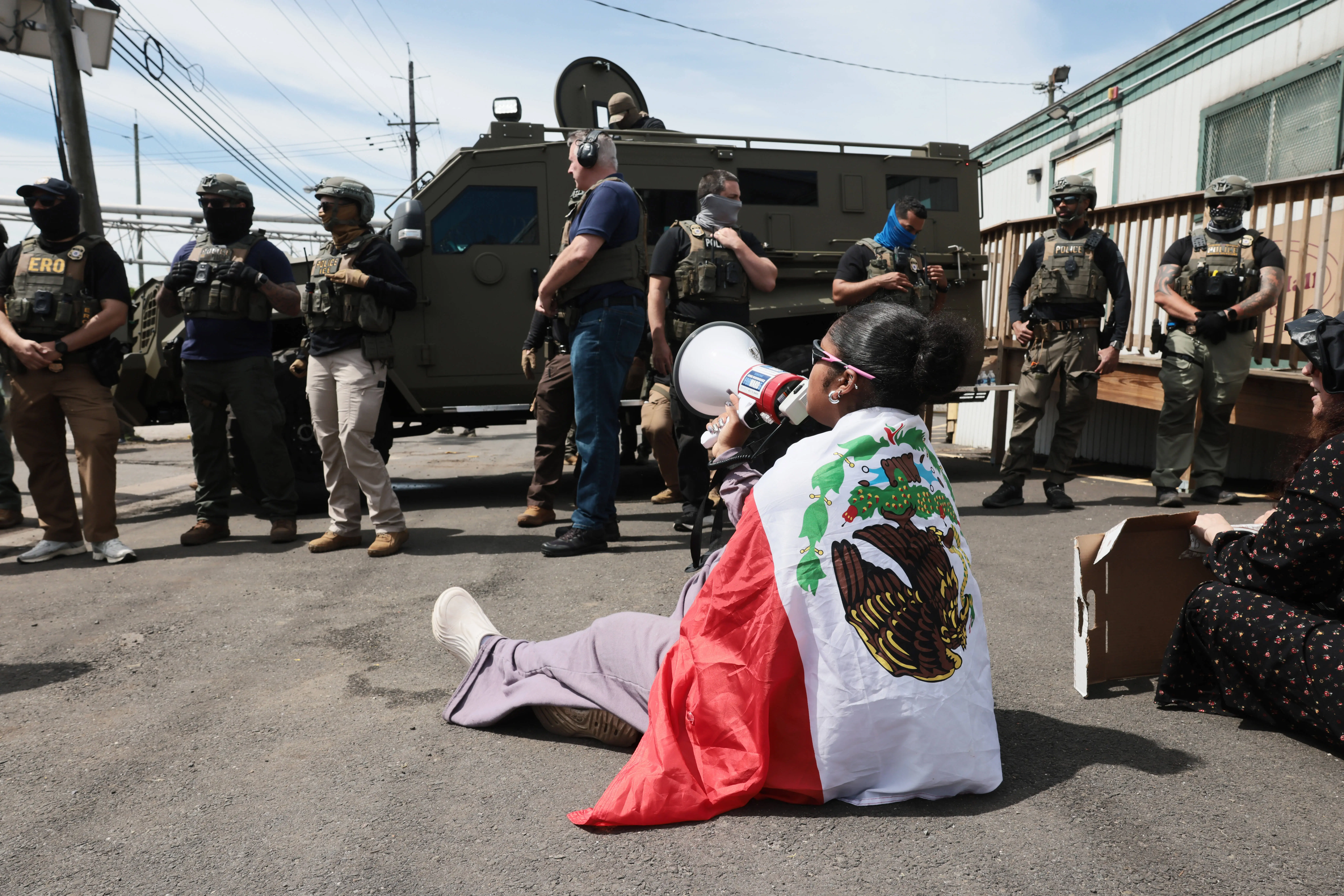 Video of 10-year-old girl asking why ICE agents won't take off their masks outside Delaney Hall detention center goes viral
