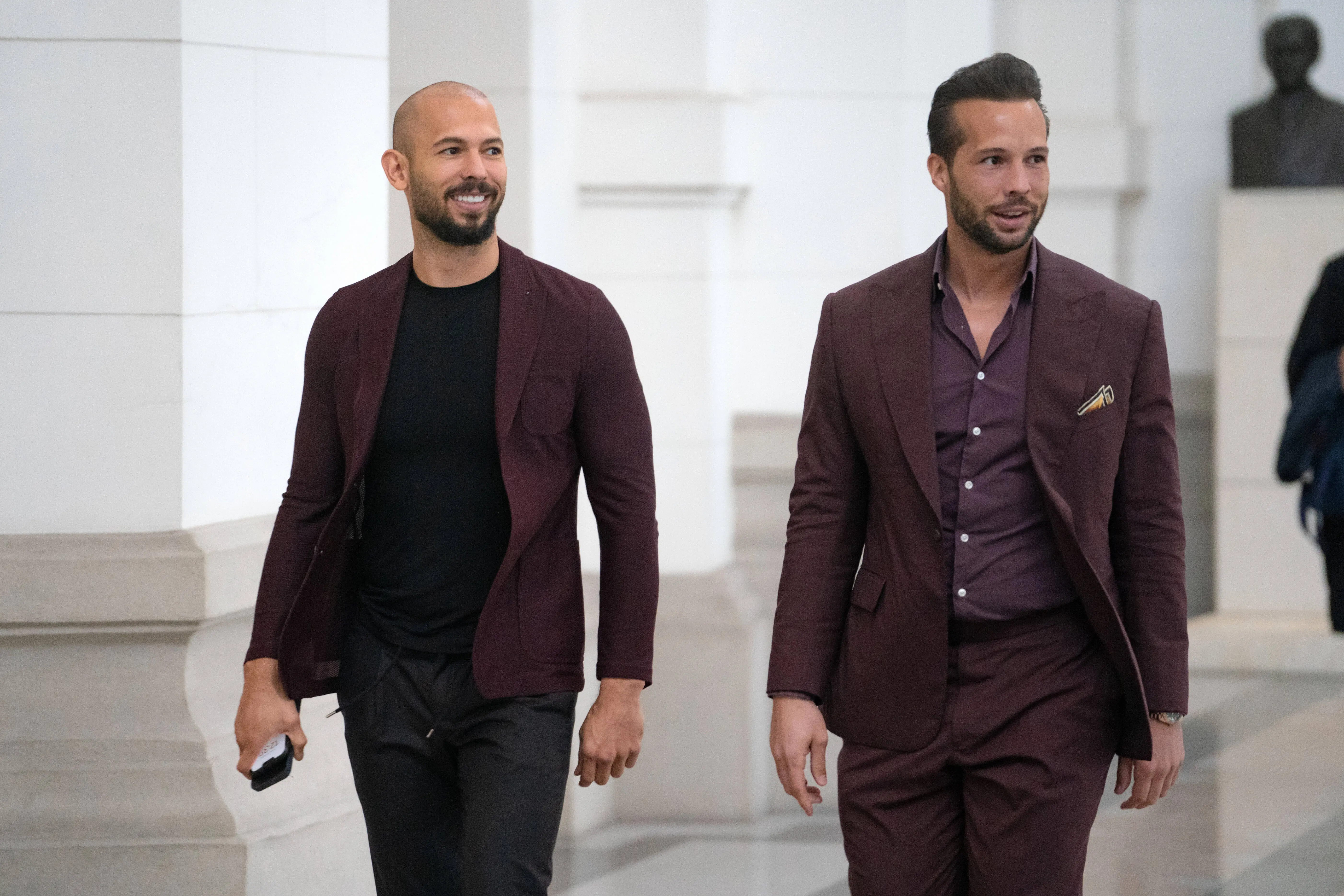 “They shop in the forever 11 section”: Andrew Tate arrest outfit sparks ...