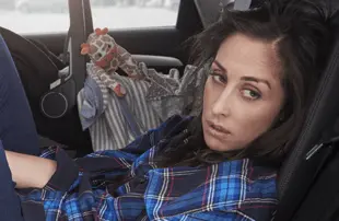 Kate (series creator and star Catherine Reitman) finds a moment to herself in Workin’ Moms. (CBC/Netflix)