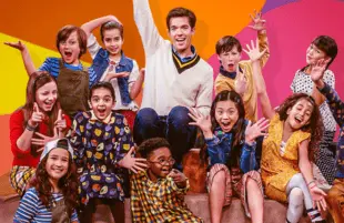 John Mulaney with the cast of his most unusual comedy special. (Netflix)