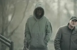 Chaos seems to follow The Outsider's hooded stranger wherever he goes. (HBO)