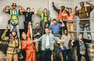 Phil Keoghan and the contestants of Tough as Nails. (CBS)