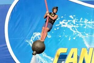 Contestant Josiah Johnson takes on ride on USA's Cannonball.  (Photo by: Eddy Chen/NBC/USA Network)