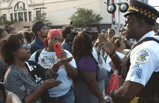Protestors confront a police officer in a scene from City So Real. (Photo: Kartemquin Films/National Geographic)